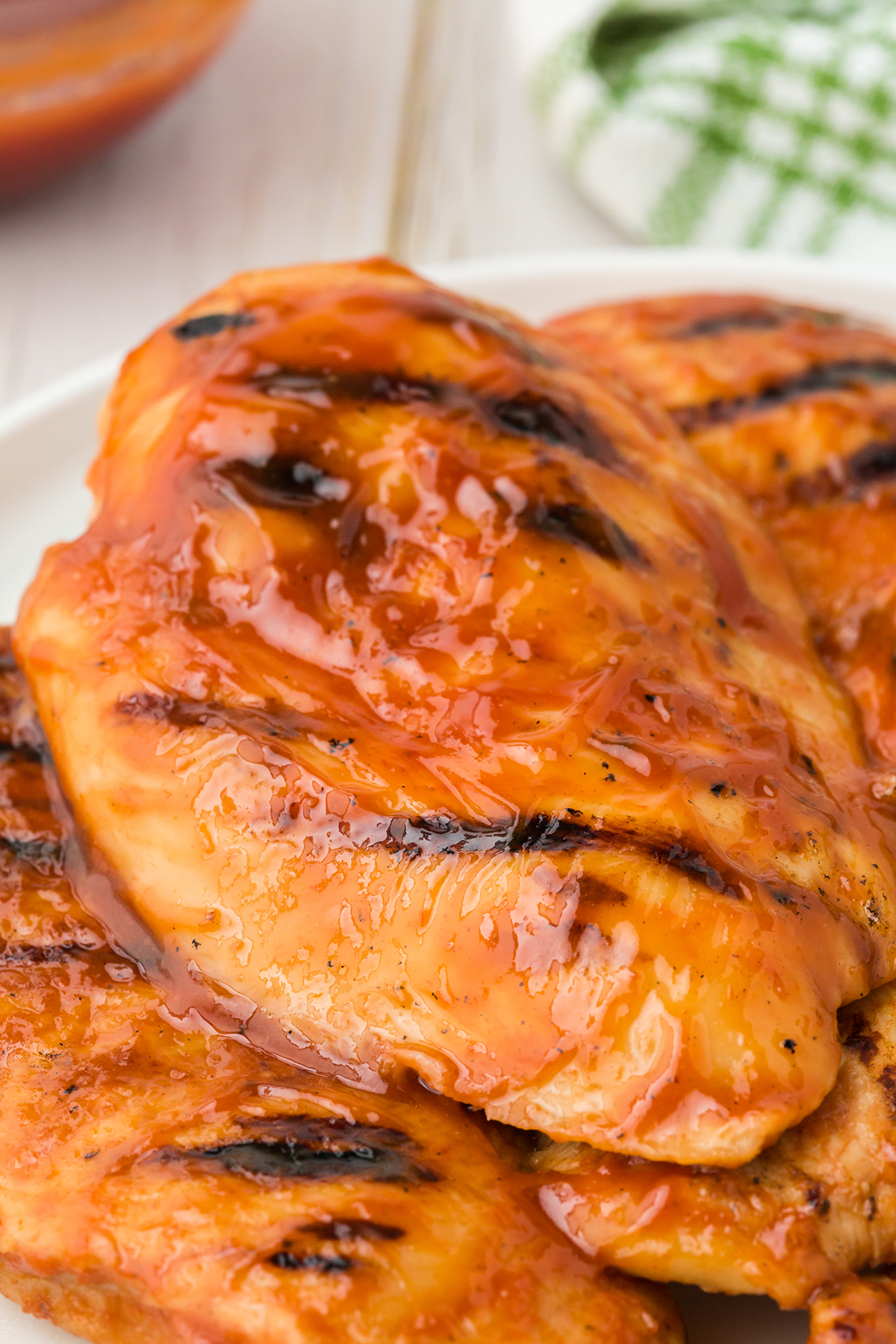 bbq chicken breasts being served on a plate