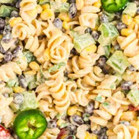 up close view of southwest pasta salad with jalapeno slices as garnish