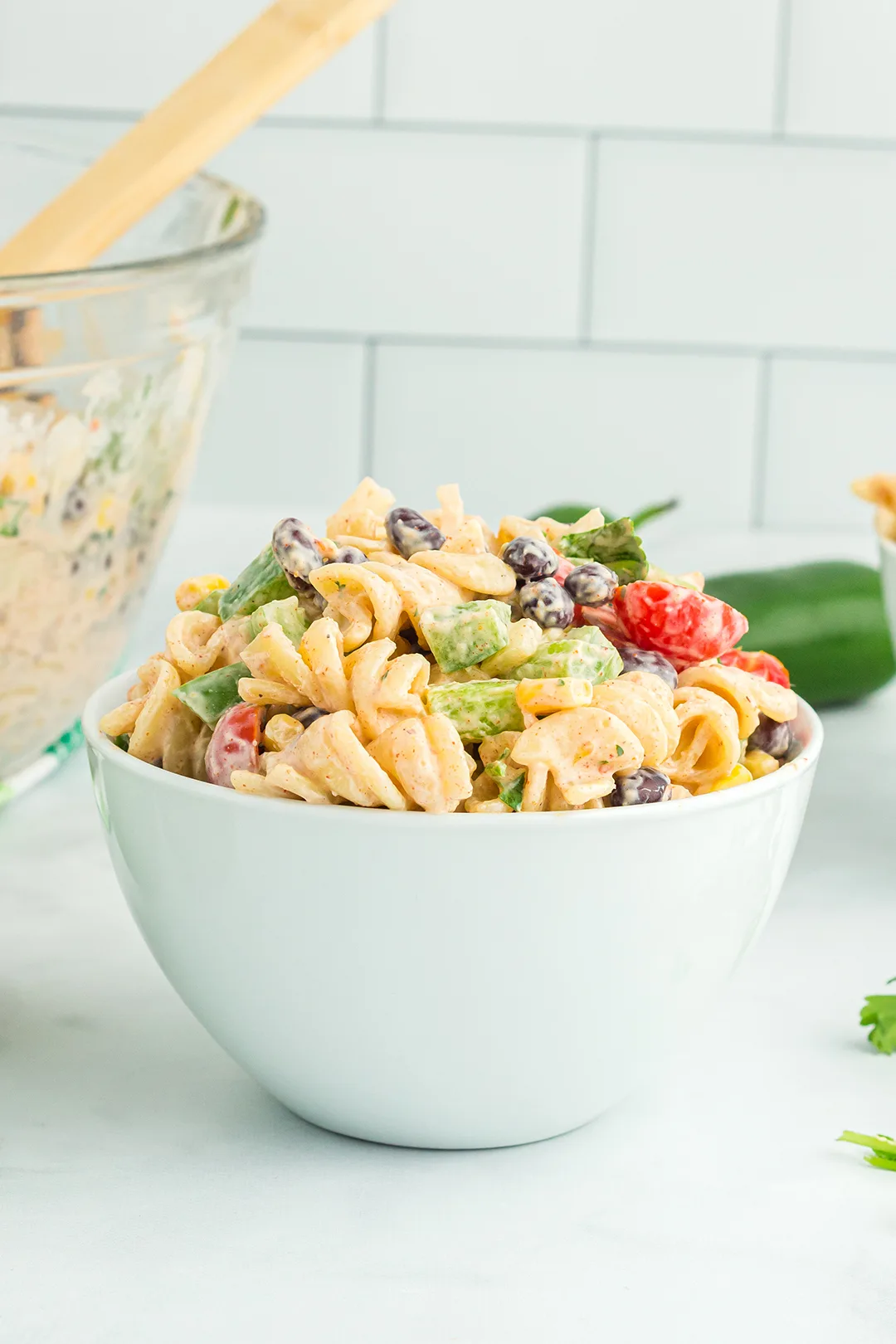 small white bowl filled with southwest pasta salad