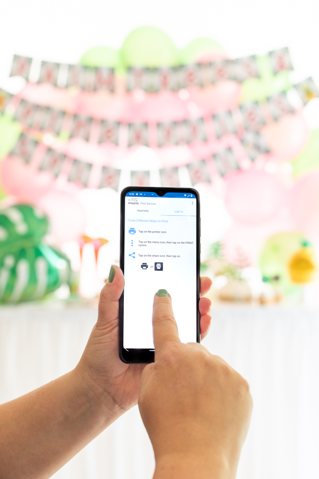 woman holding android phone demonstrating how to print with mopria app