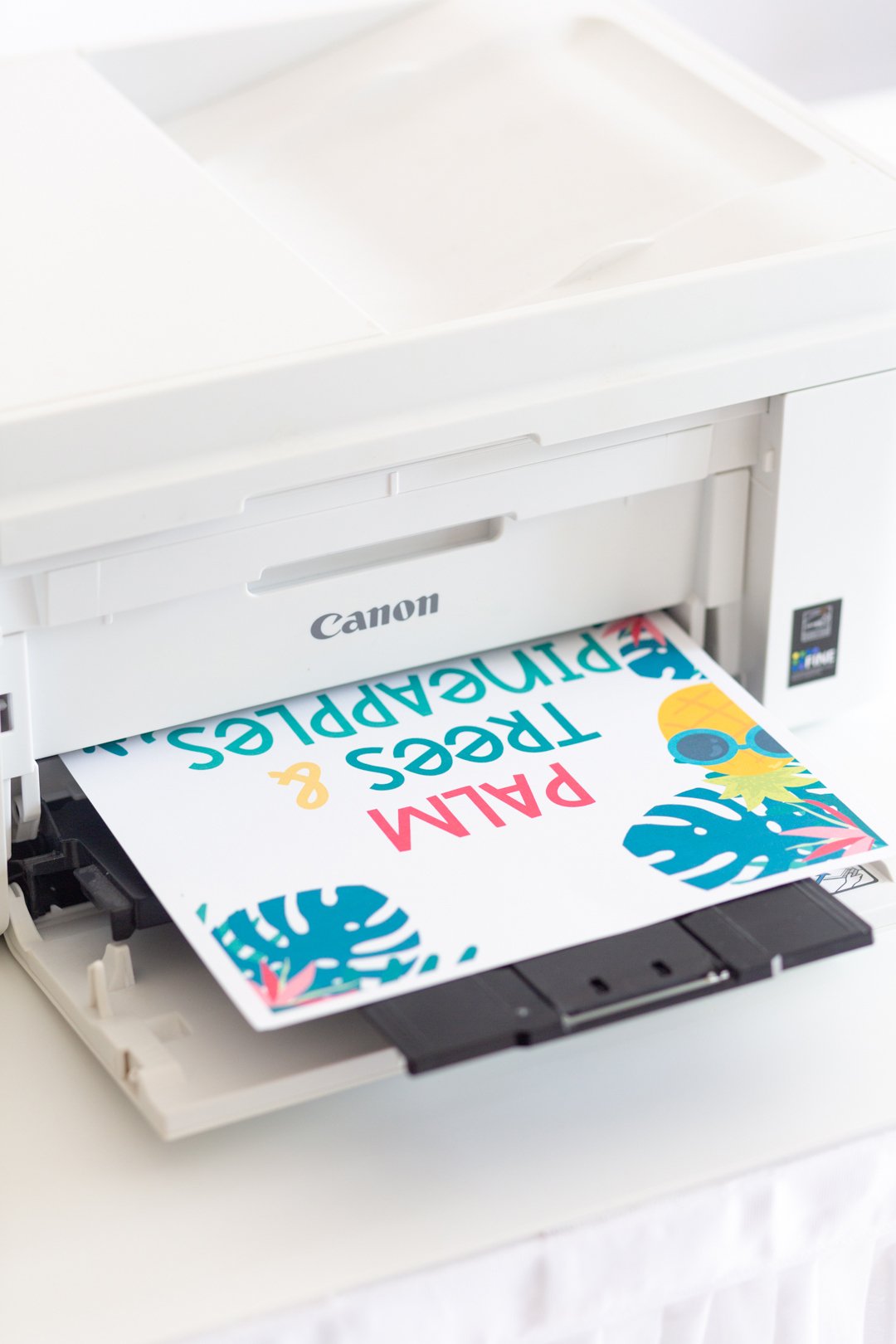 canon printer with colorful tropical party printable being printed