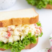 slightly angled down photo of radio sandwiches otherwise known as egg salad with pimientos and walnuts