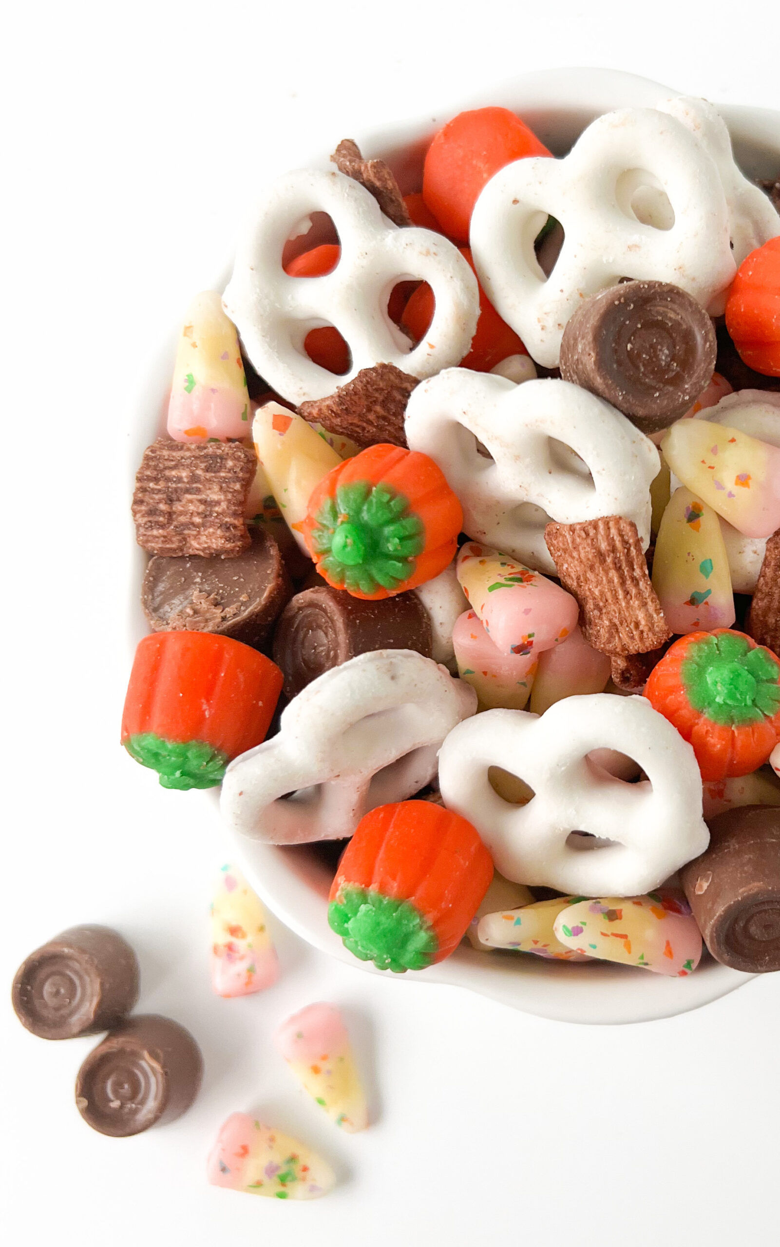 up close fall snack mix with cereal, pretzels, chocolates and candy corns