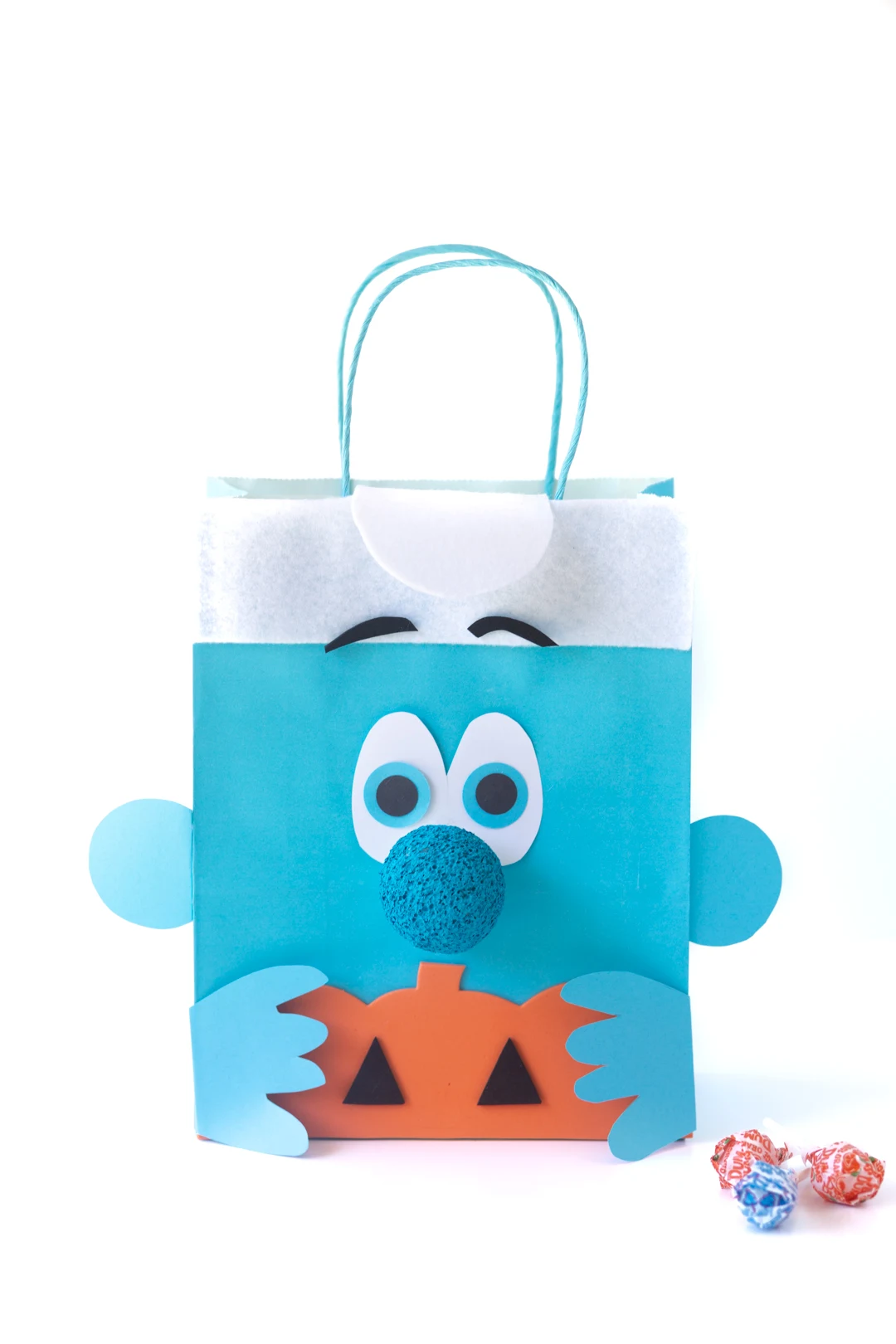 cute smurf halloween treat bag diy project. smurf holding foam pumpkin.