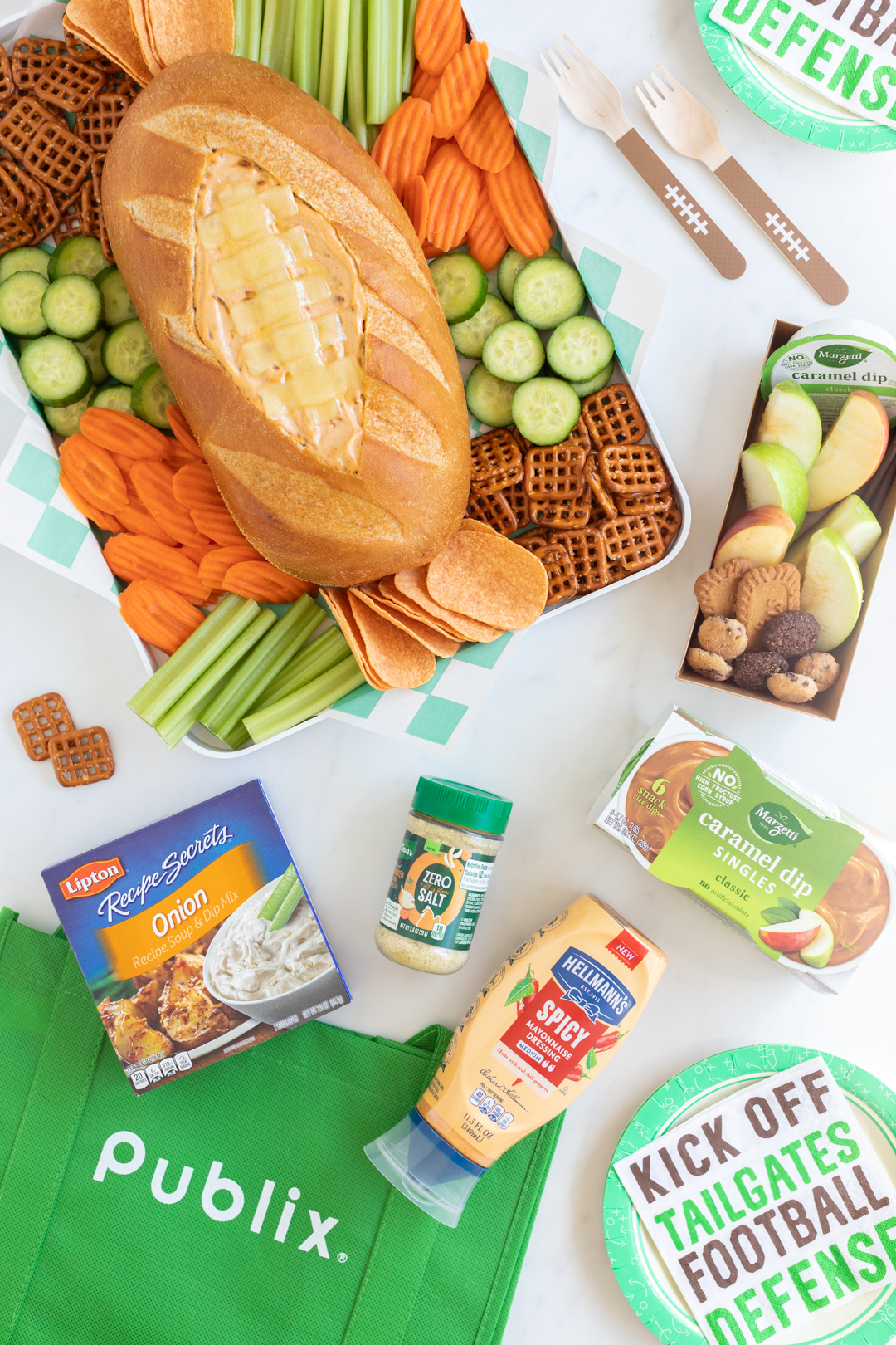 ingredients used to make football dip bread bowl and green reusable bag