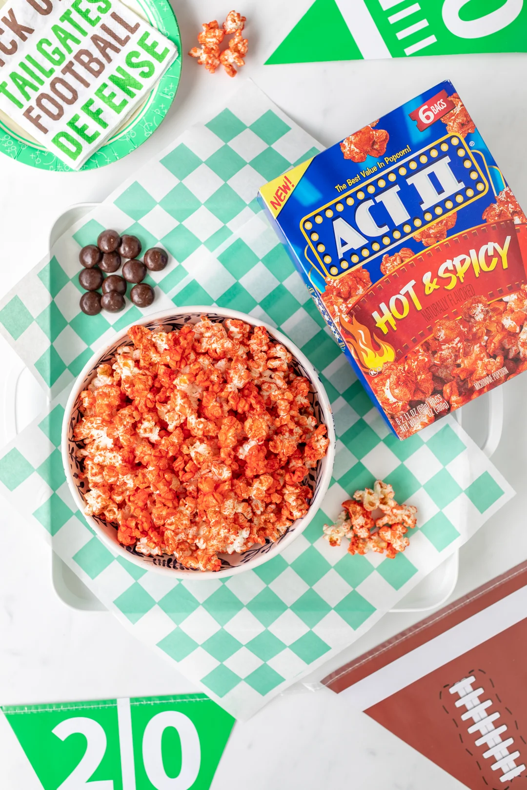 game day spread with spicy popcorn and candy