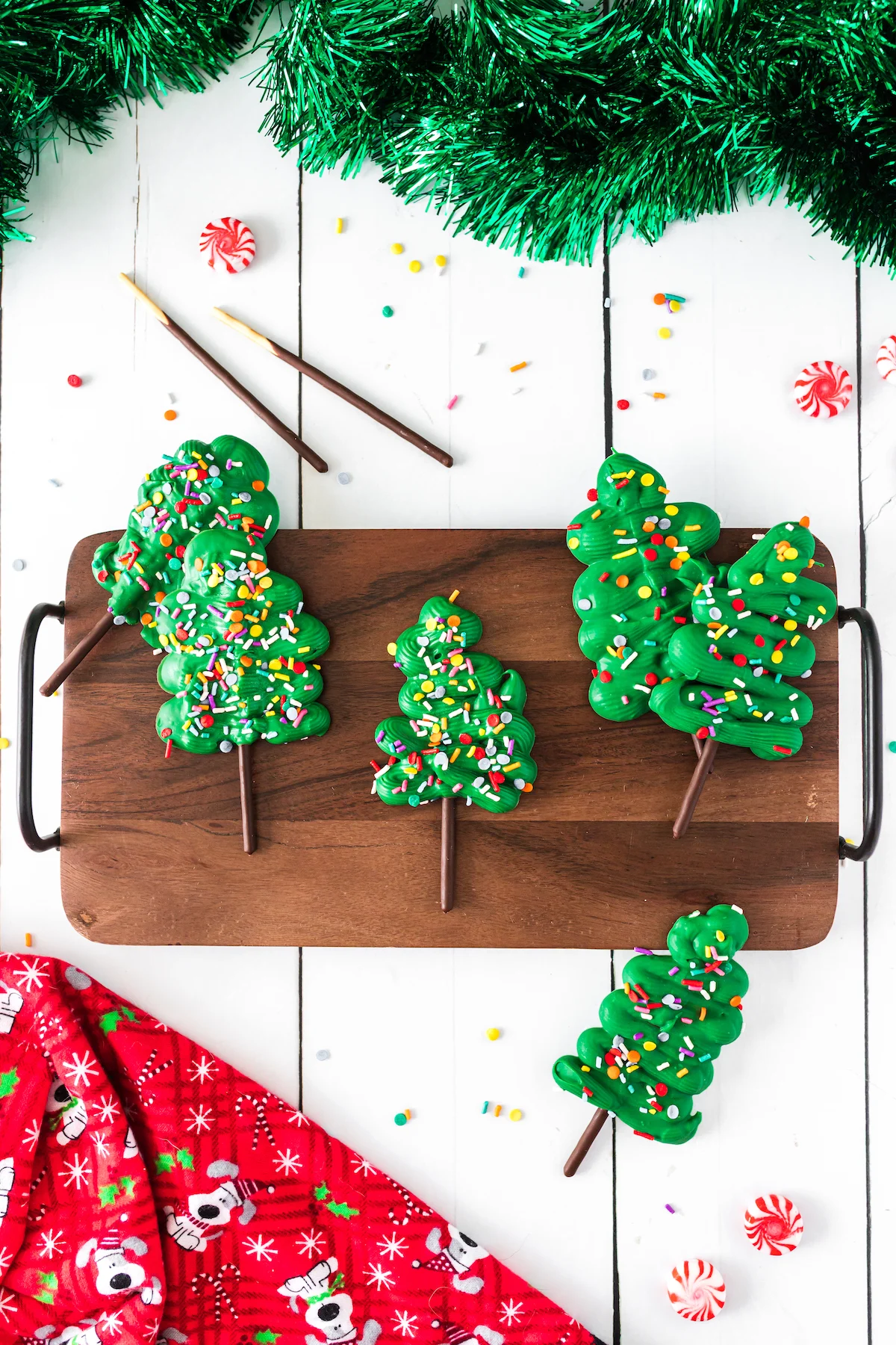 pocky christmas trees on a serving platter on a white wood table