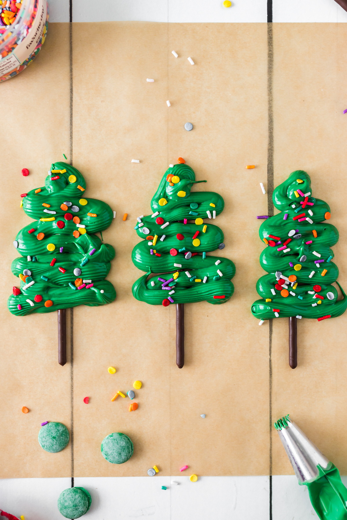 sprinkles added to chocolate and pocky christmas trees
