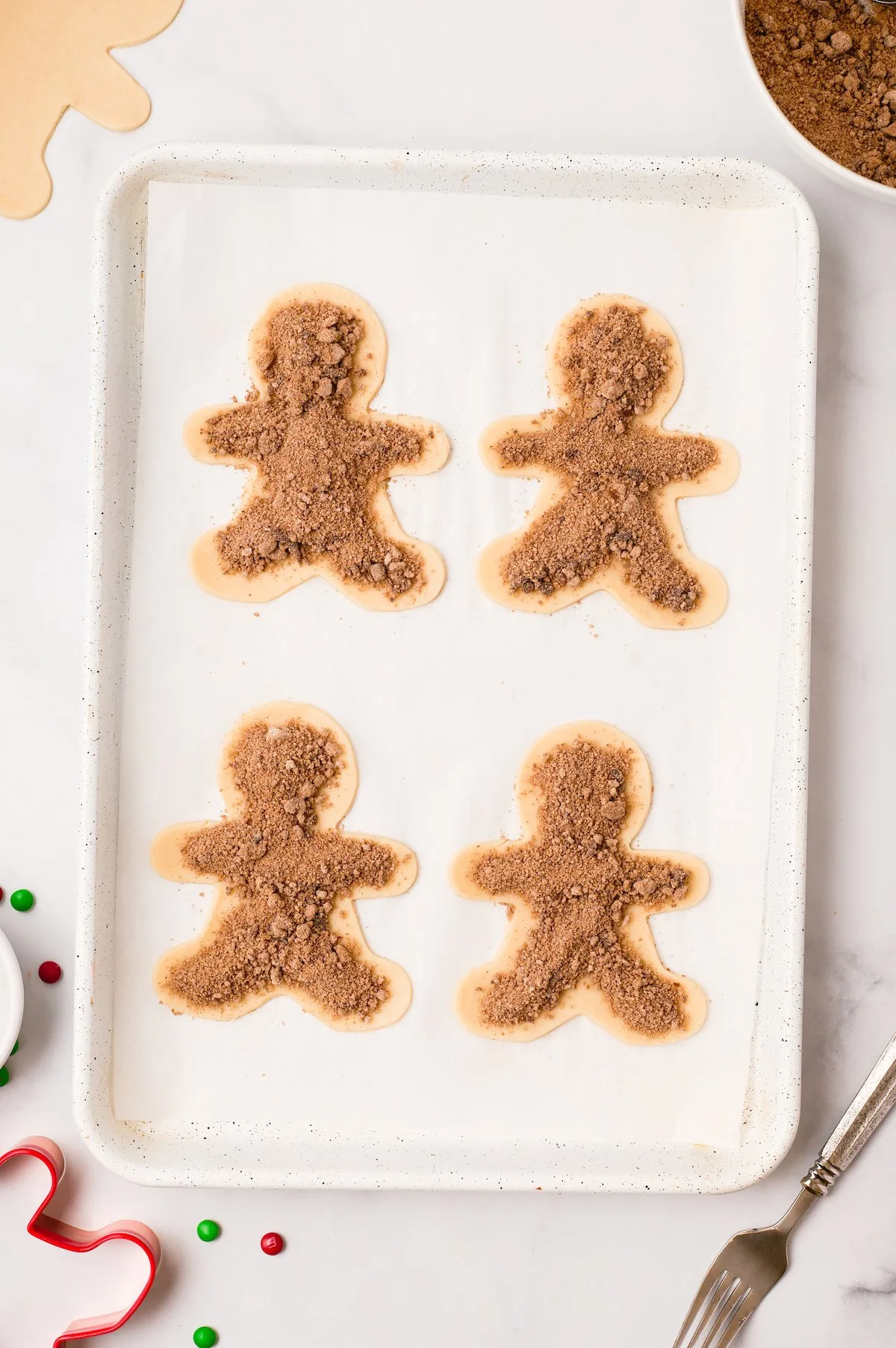 filling placed on top of gingerbread men dough cut outs