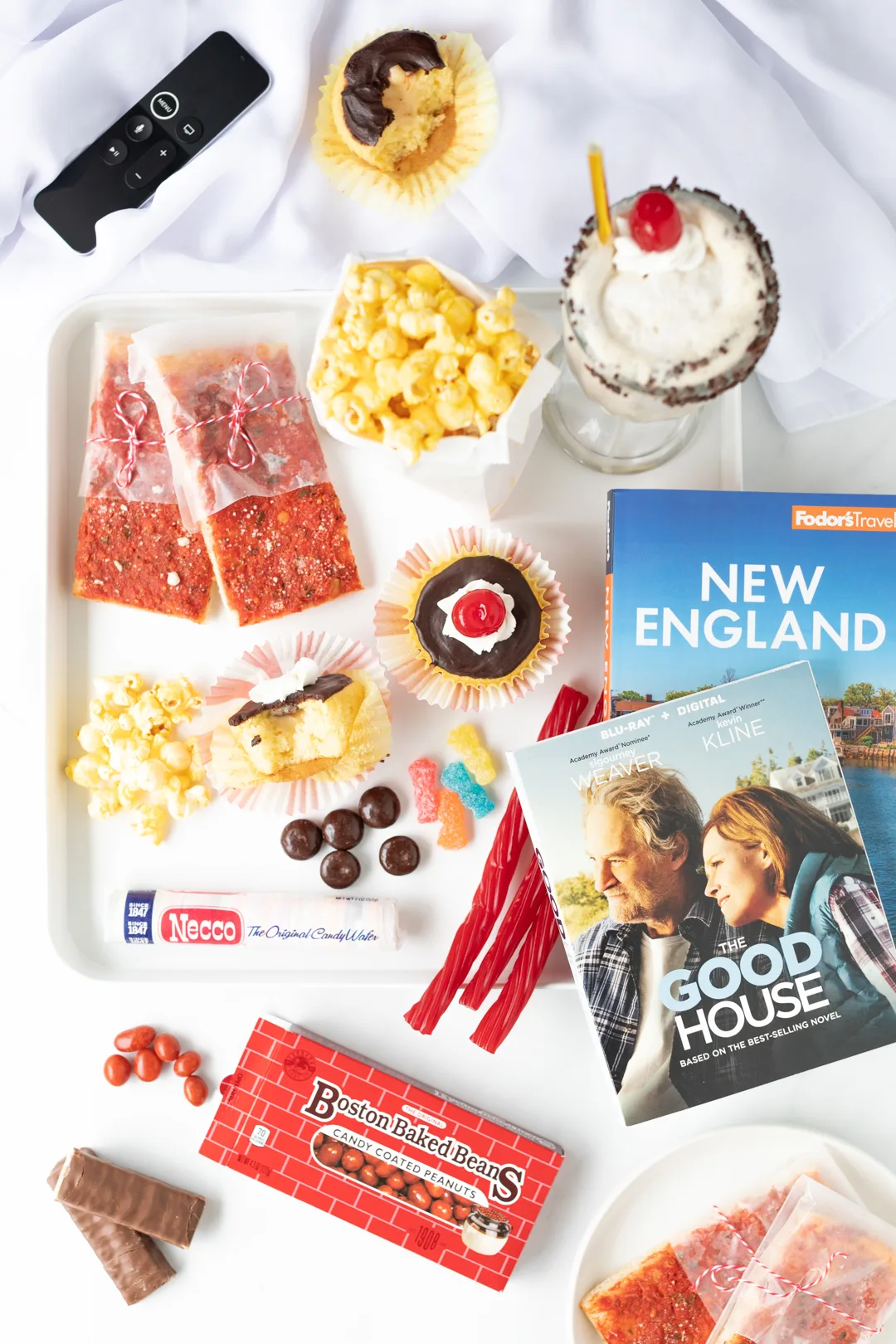 the good house movie snack tray with popcorn and candies that are new england theme