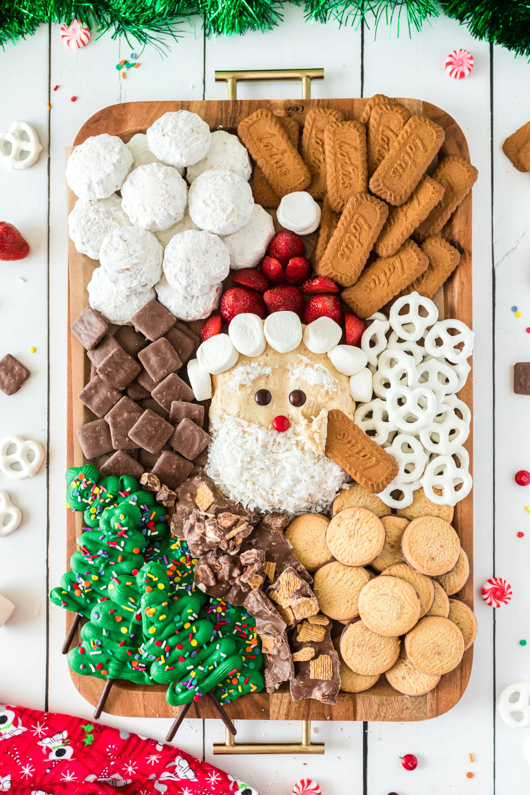 adorable santa clause charcuterie board with cookie dippers