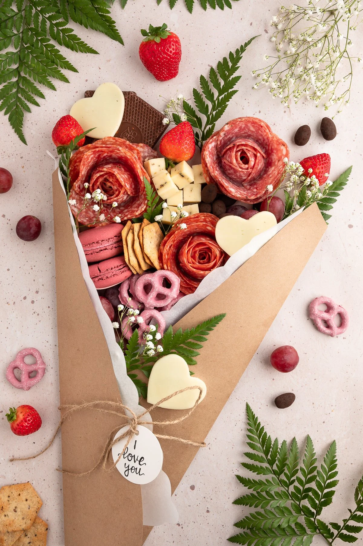 gorgeous charcuterie bouquet made with floral supplies, meats, cheeses and desserts