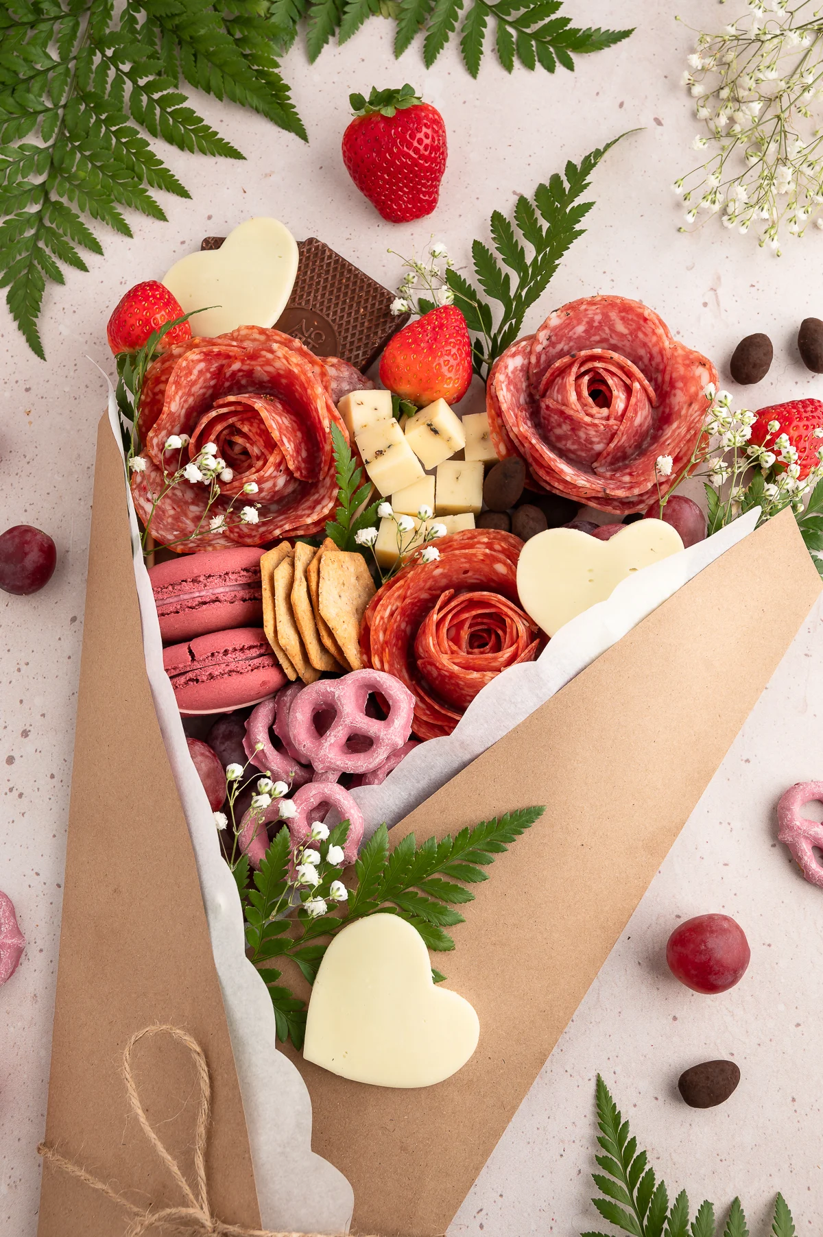 pretty charcuterie board made inside a floral bouqet