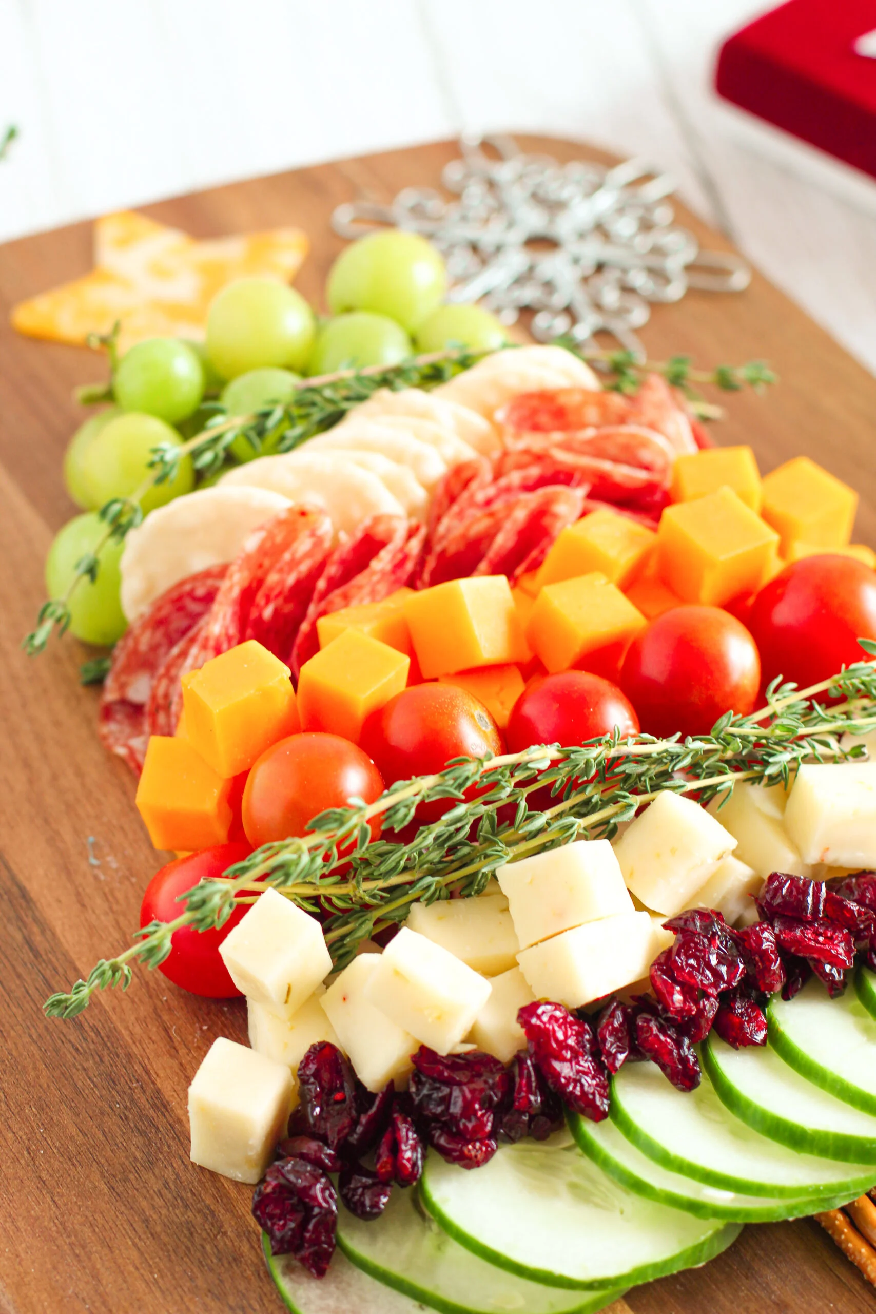 christmas tree appetizer snack board angled view. layers of veggies and cheeses.