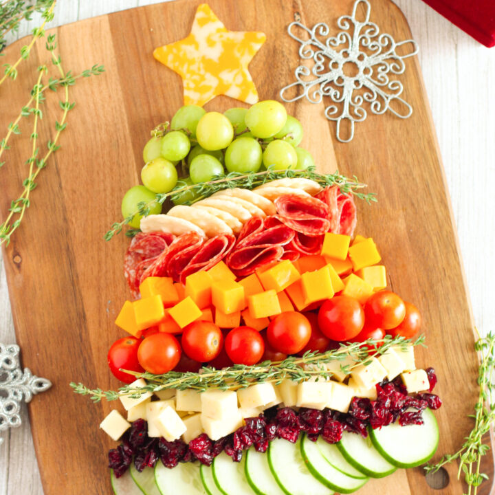 over the top angled view of a snack board shaped like a christmas tree