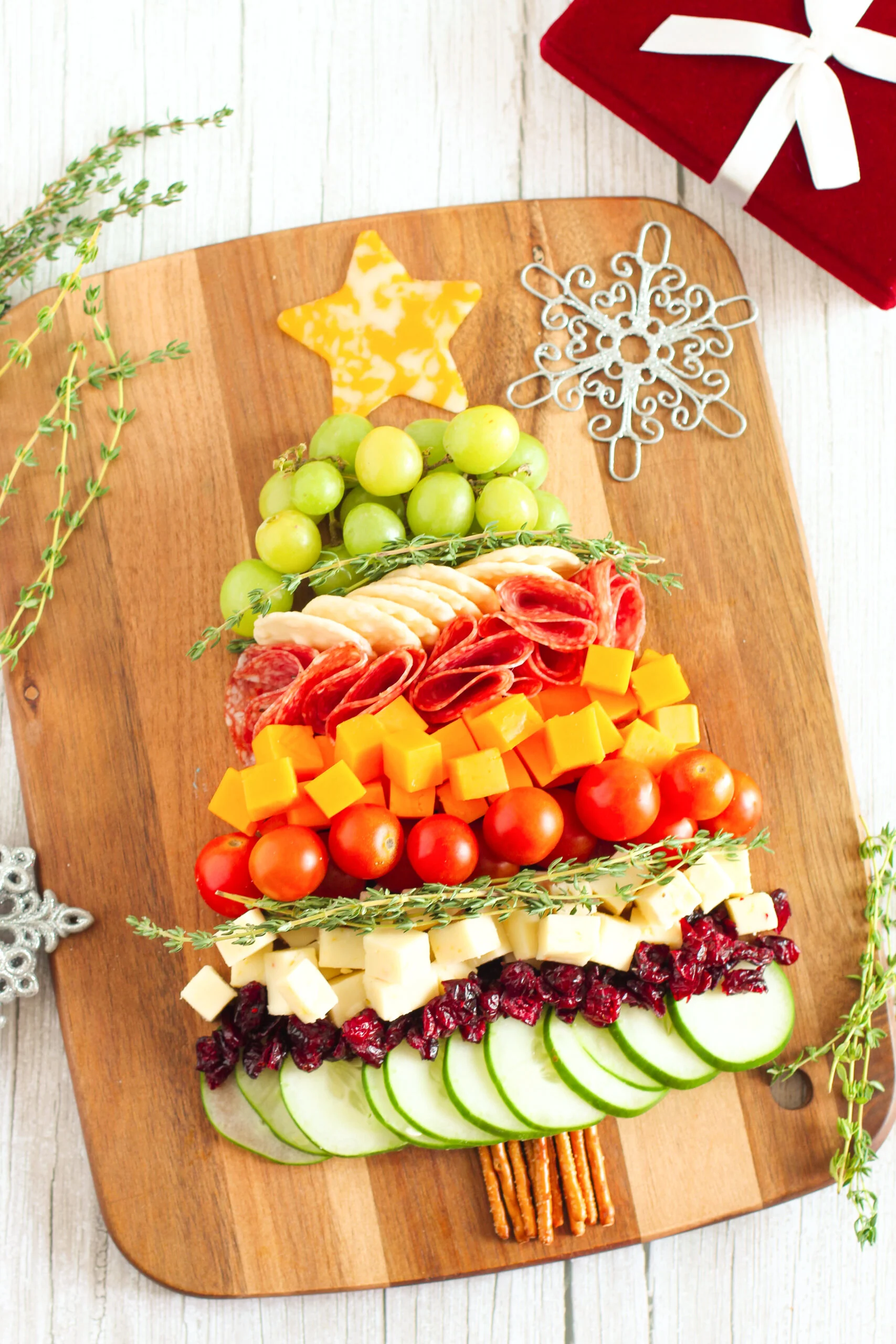 over the top angled view of a snack board shaped like a christmas tree appetizer