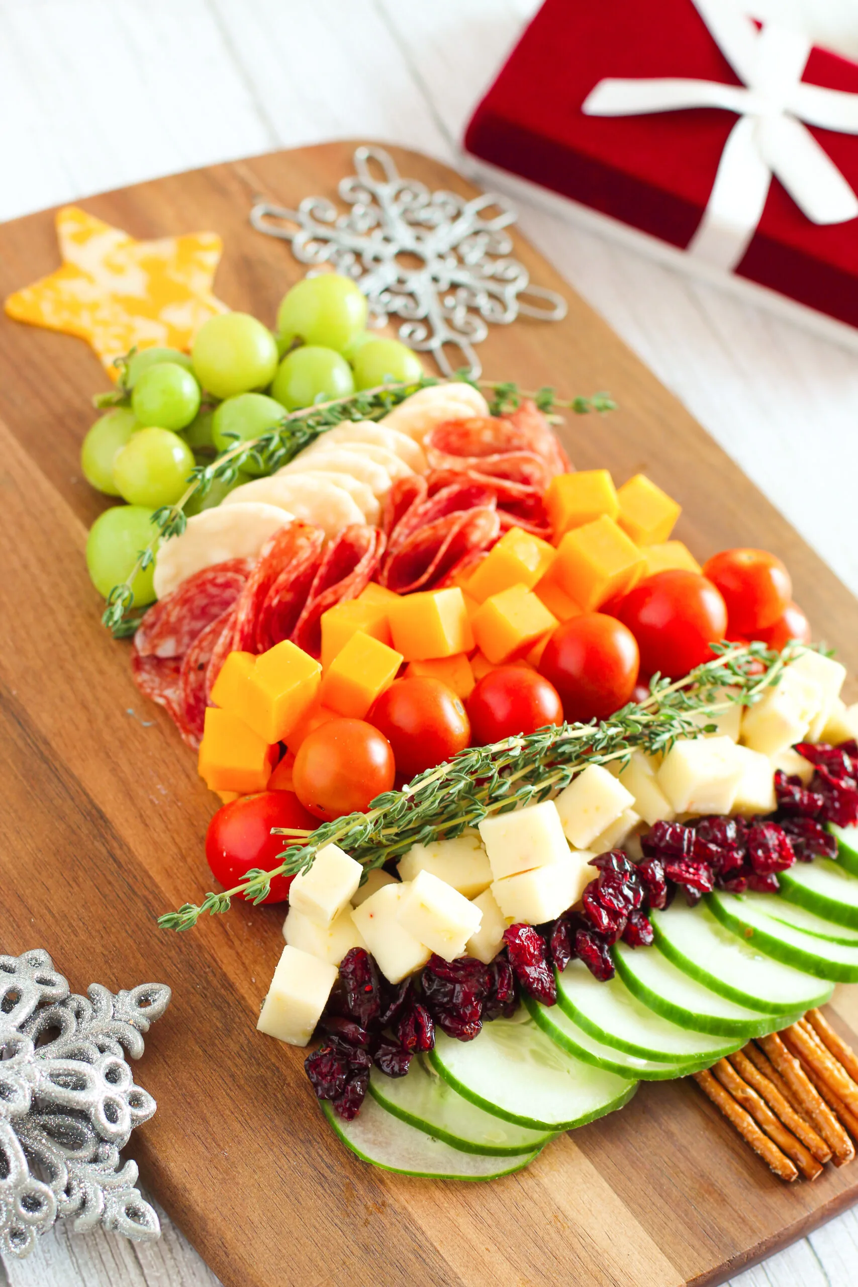 angled view of a festive christmas appetizer tree snack board