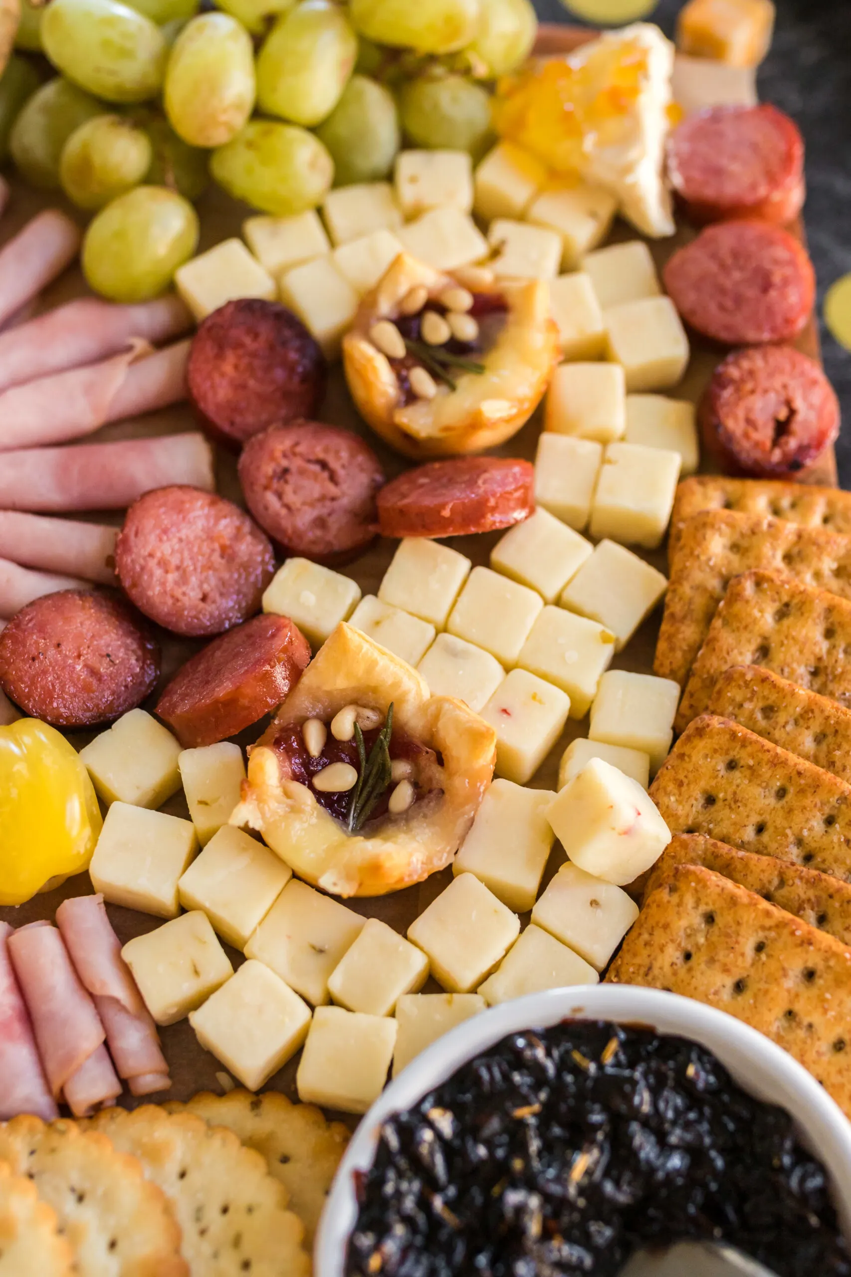 three spelled out with cheese for a 2023 charcuterie board