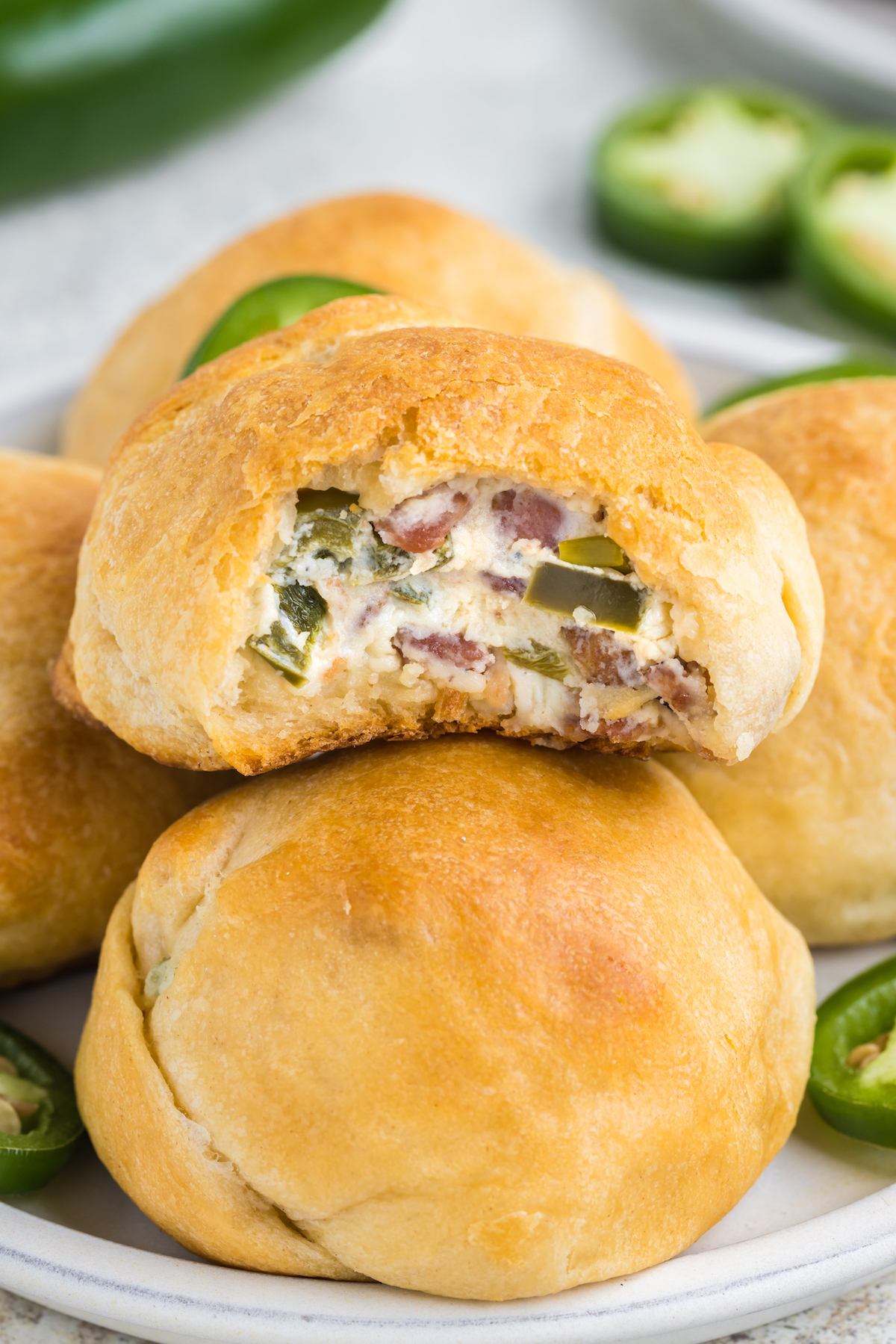 stacked jalapeno rolls on a plate