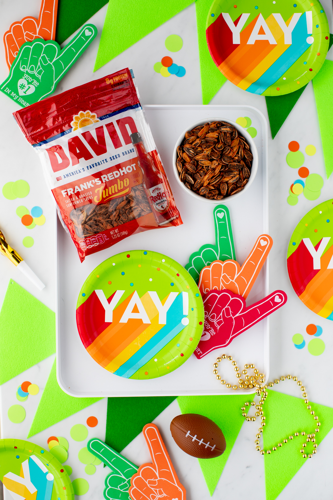 David Sunflower Seed bag set on rainbow colored football party table