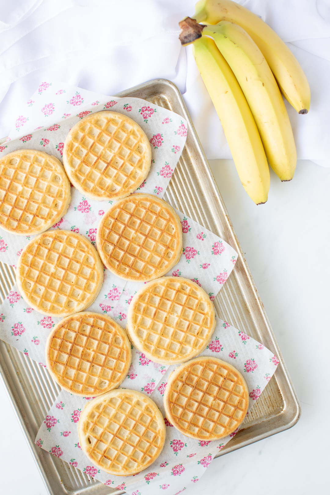 eggo waffles set on a baking sheet to prepare for serving