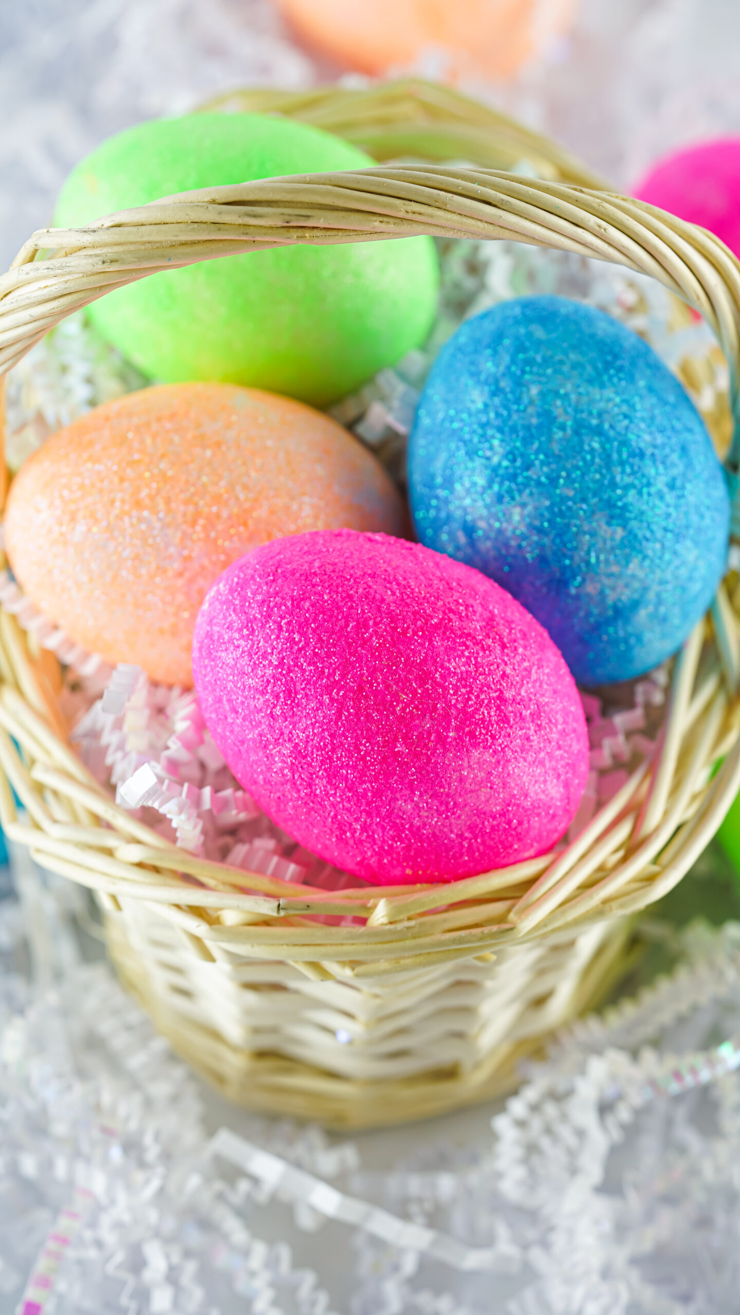 natural easter basket filled with pretty diy glitter easter eggs