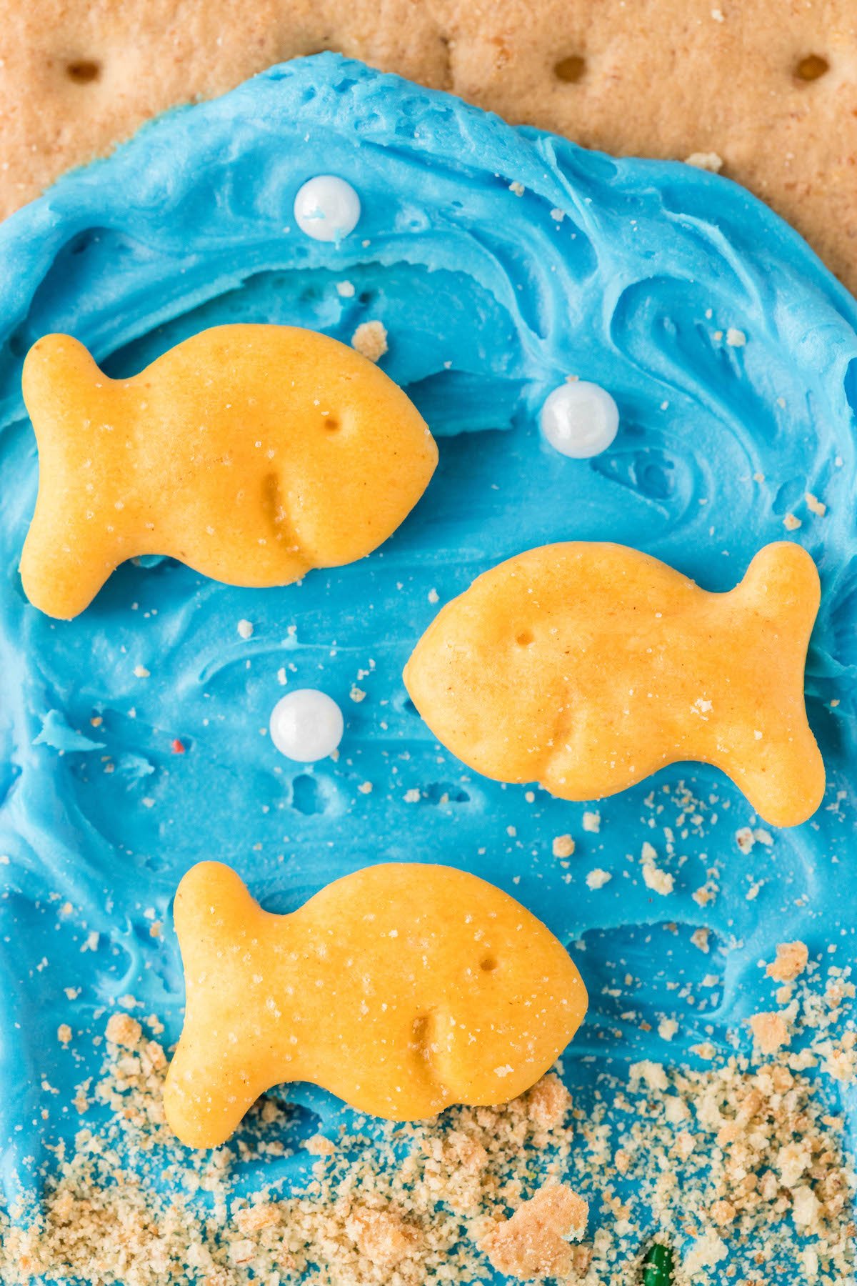 super up close view of a goldfish cracker treat that looks like the ocean.
