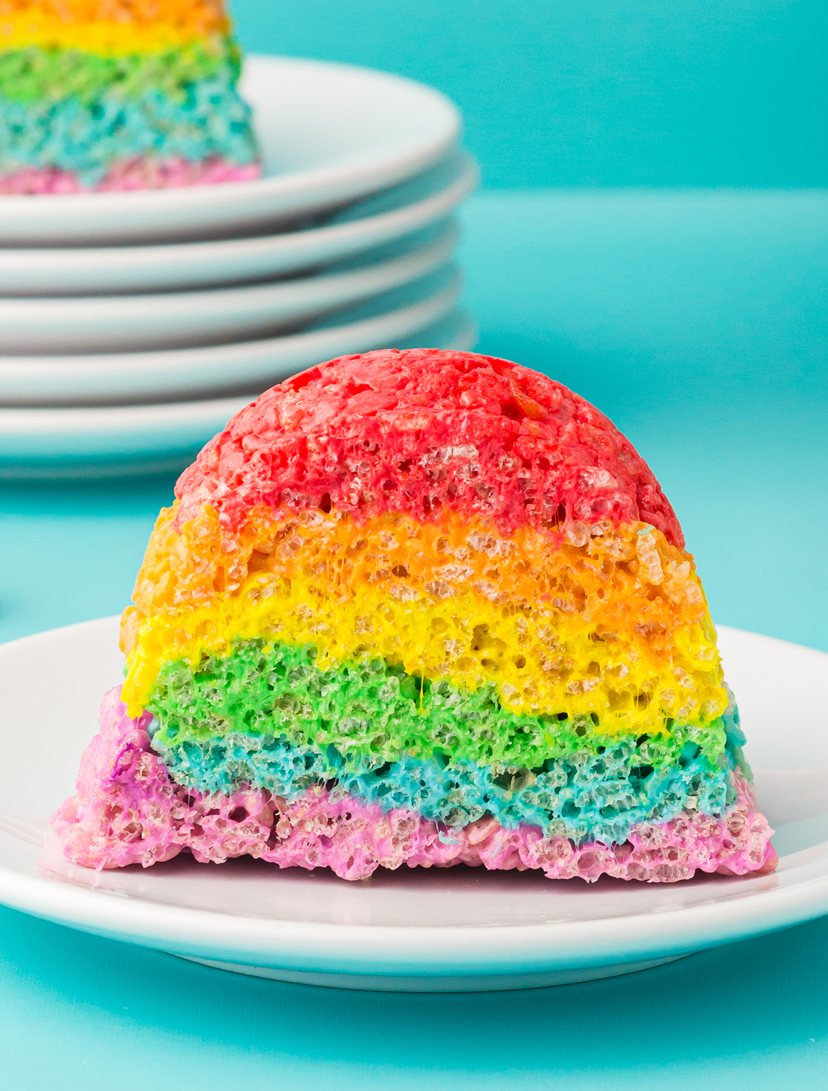 up close slice of rainbow rice krispies cake