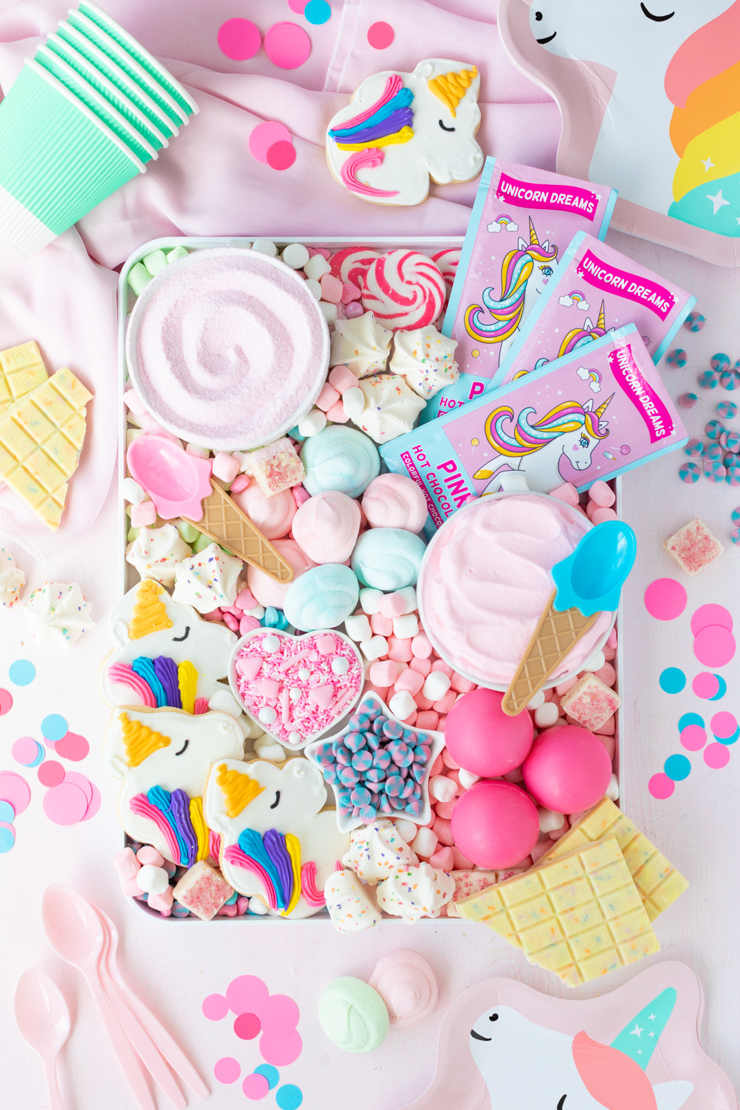gorgeous pastel unicorn hot cocoa board, charcuterie style. loaded with pink hot chocolate, pastel marshmallows and more.