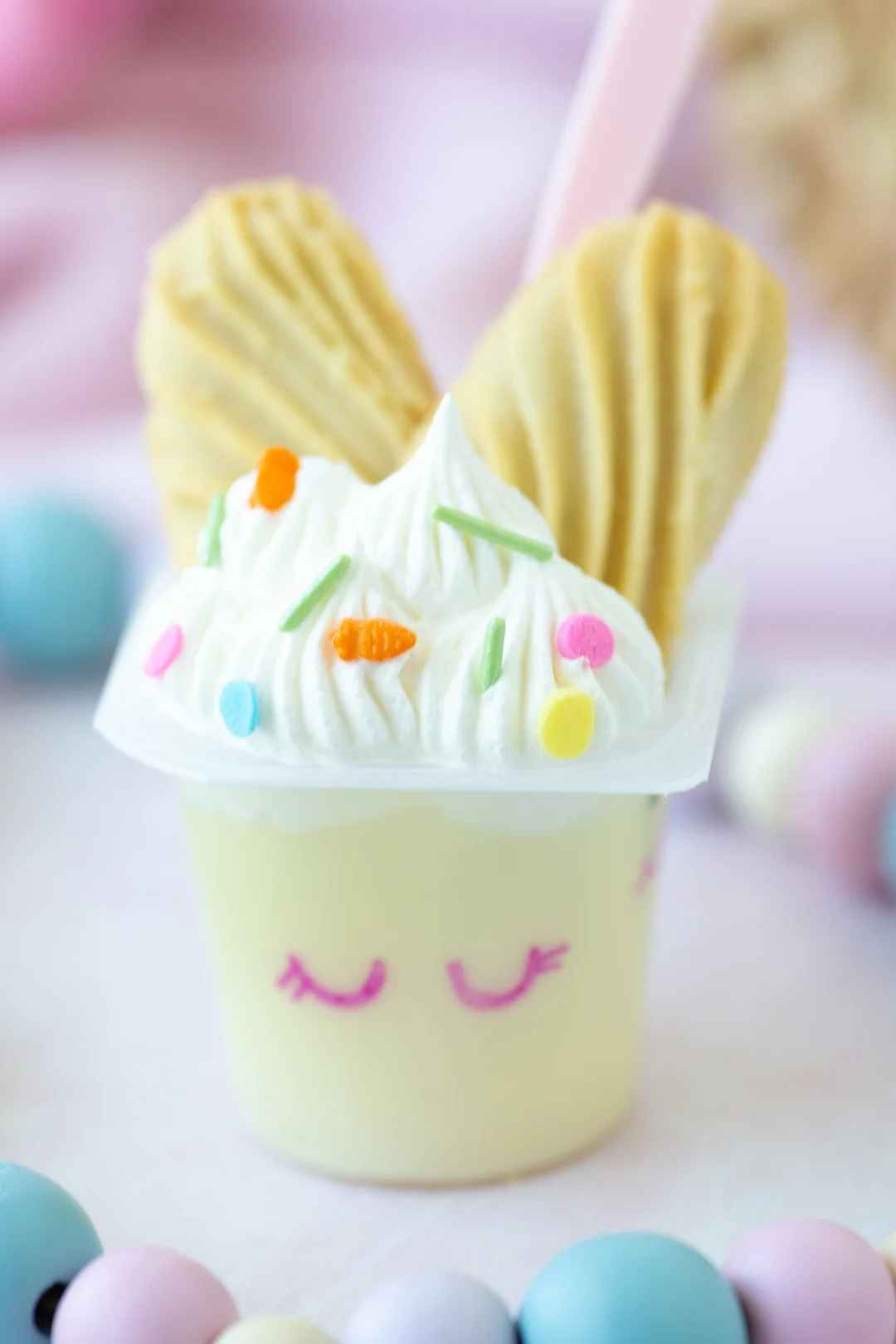 up close view of bunny inspired vanilla pudding cups with shortbread used for ears