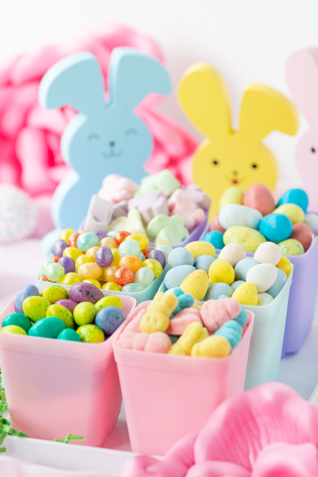 angled view of a candy garden with pastel candies.