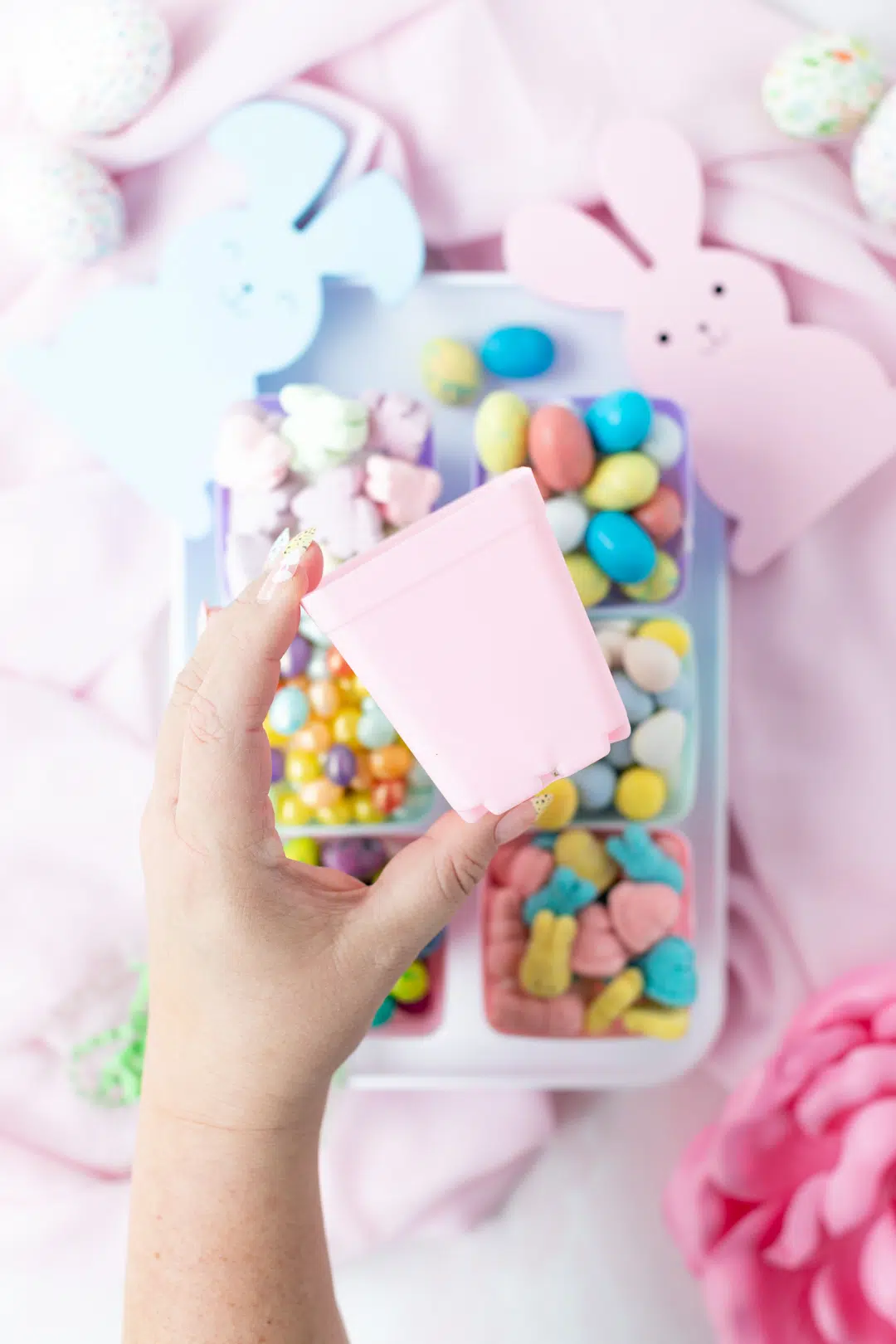 small pink plastic pastel planter used for holding candy for entertaining