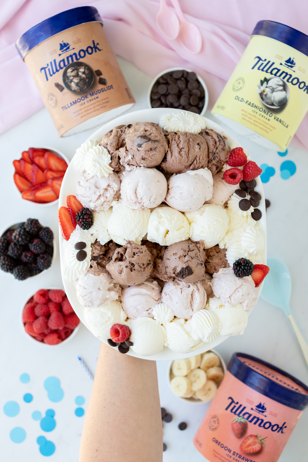 serve an ice cream scoop party platter with fruit on top