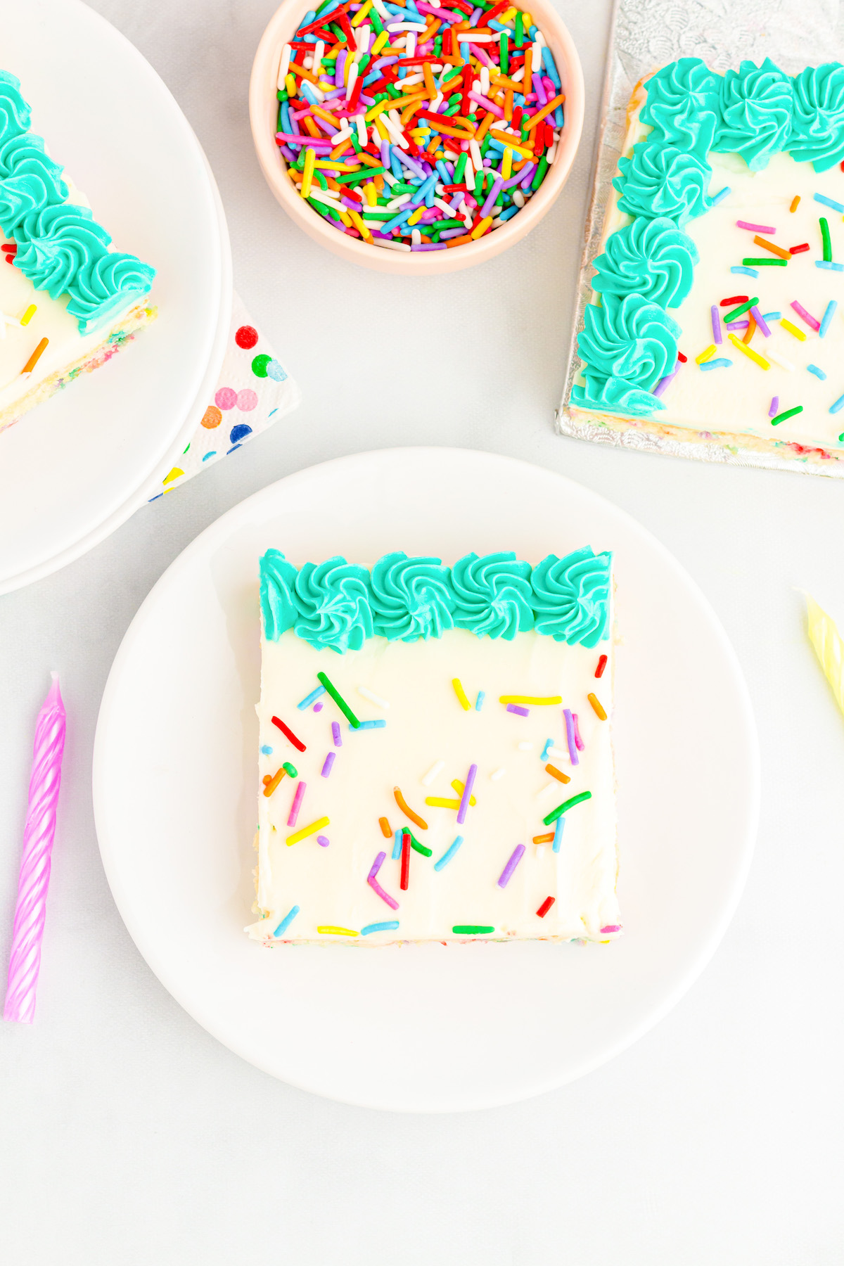 over the top image of birthday cake slice on a small dish