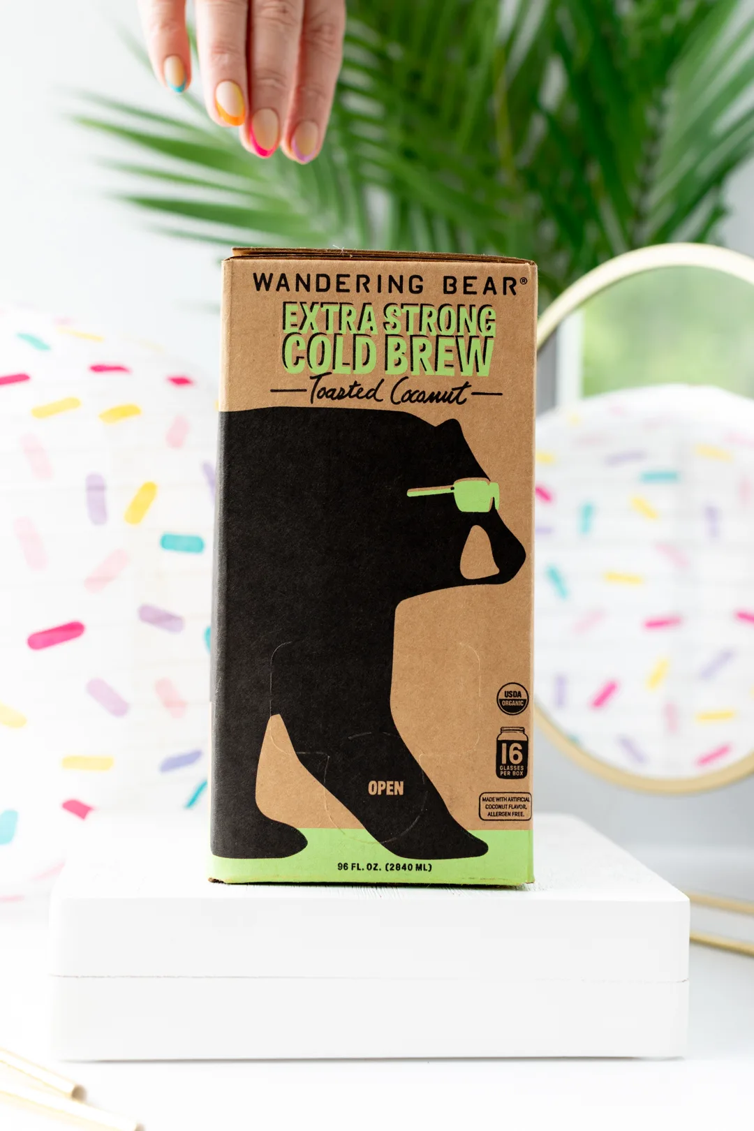 wandering bear extra strong cold brew box, woman reaching for it