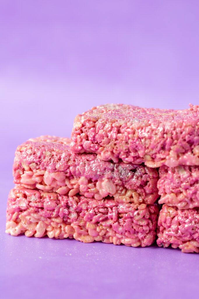 up close bright pink glittery rice krispie treat bars inspired by transformers