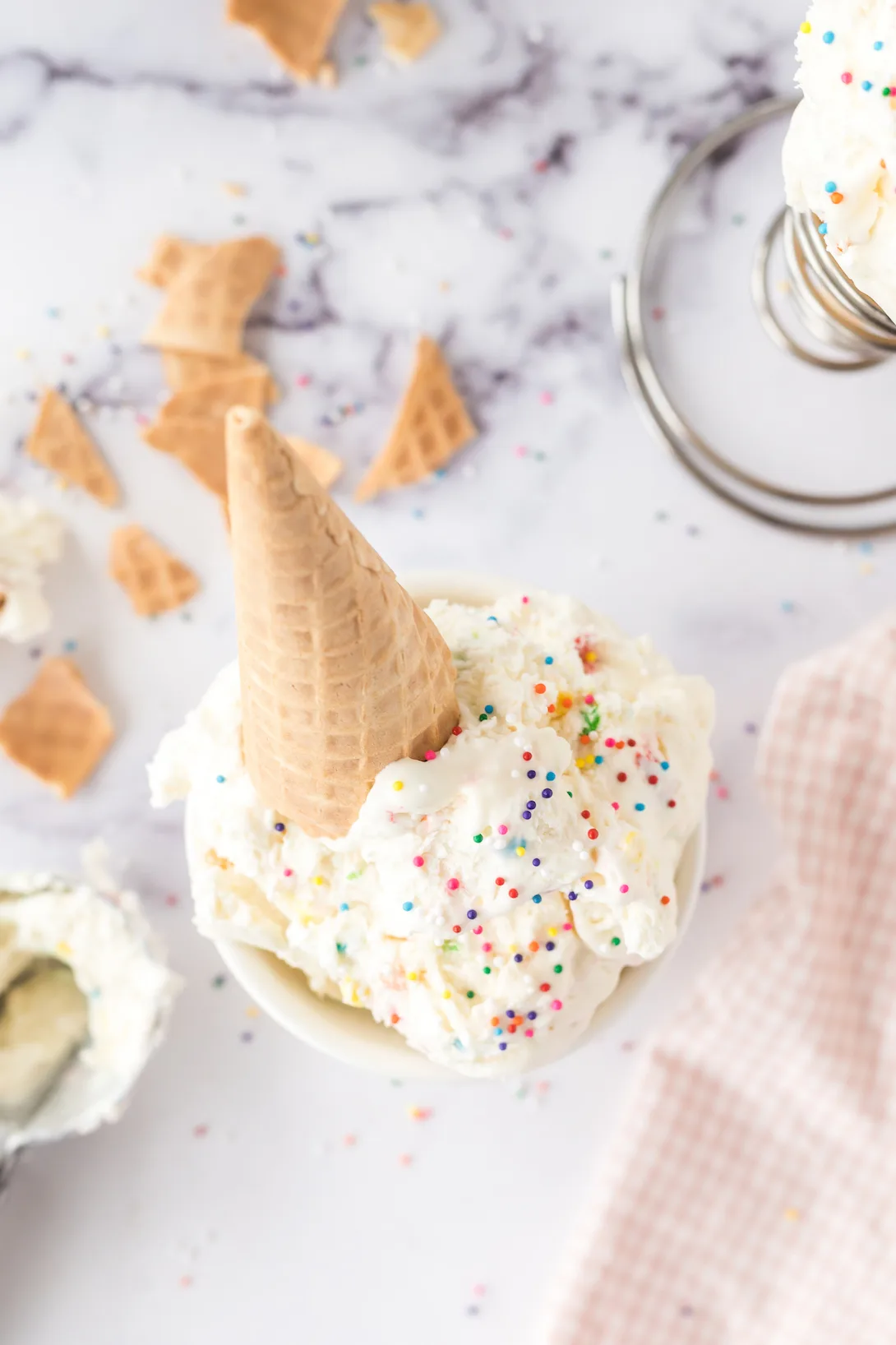 angled down funfetti ice cream sundae with sprinkles on top.