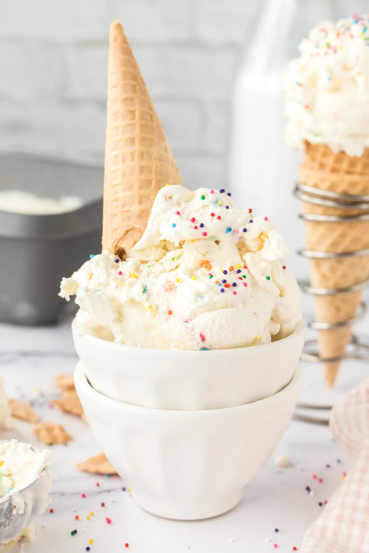 funfetti ice cream scoops in a double stacked dish