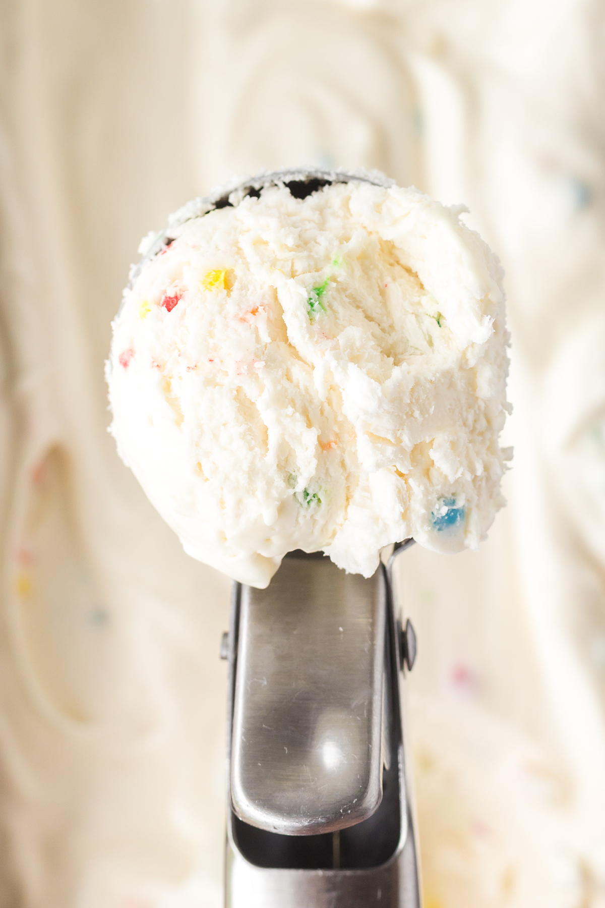 funfetti ice cream scooped out of tub
