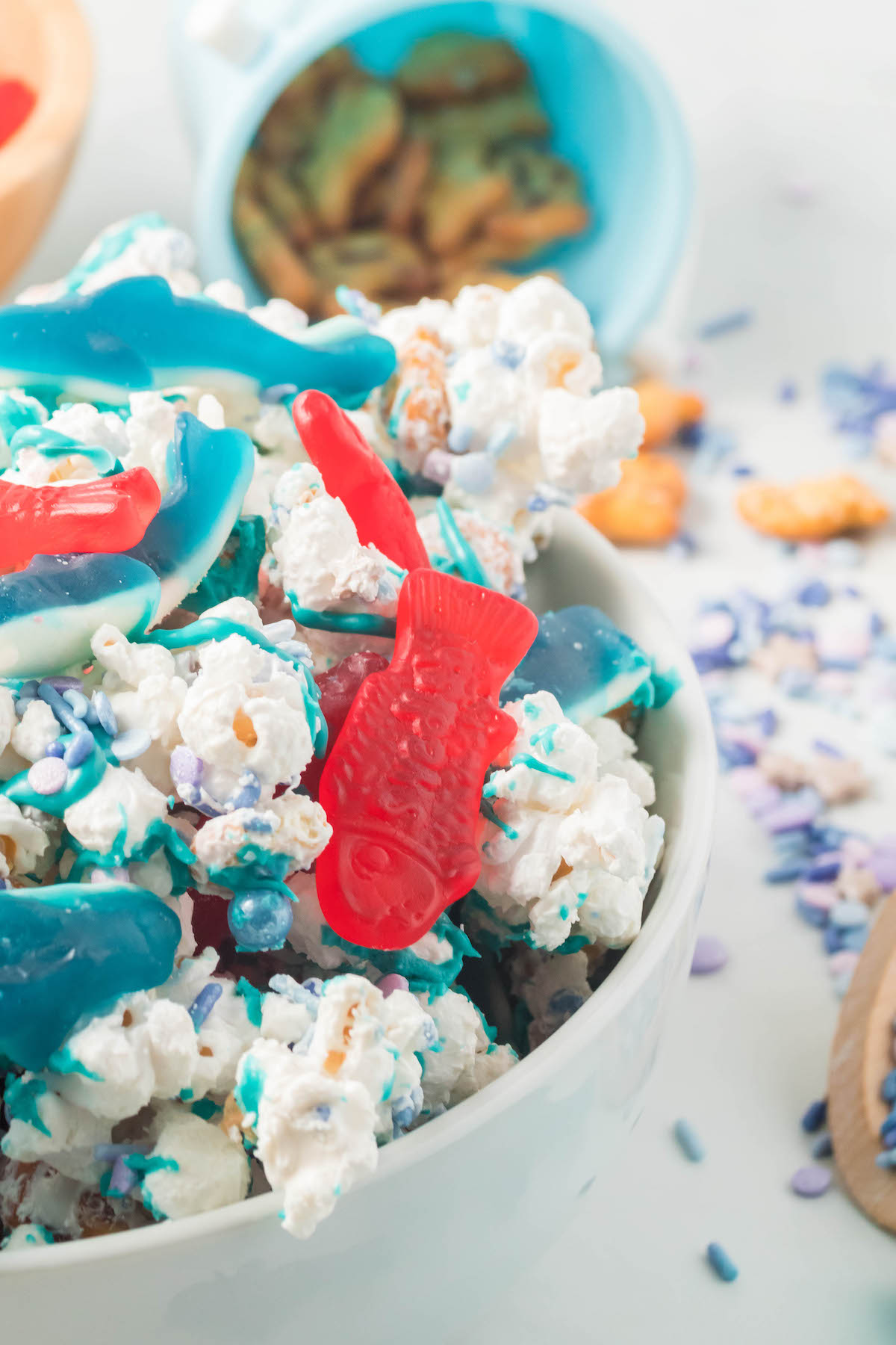 up close dish of shark bait snack mix with swedish fish and gummy sharks
