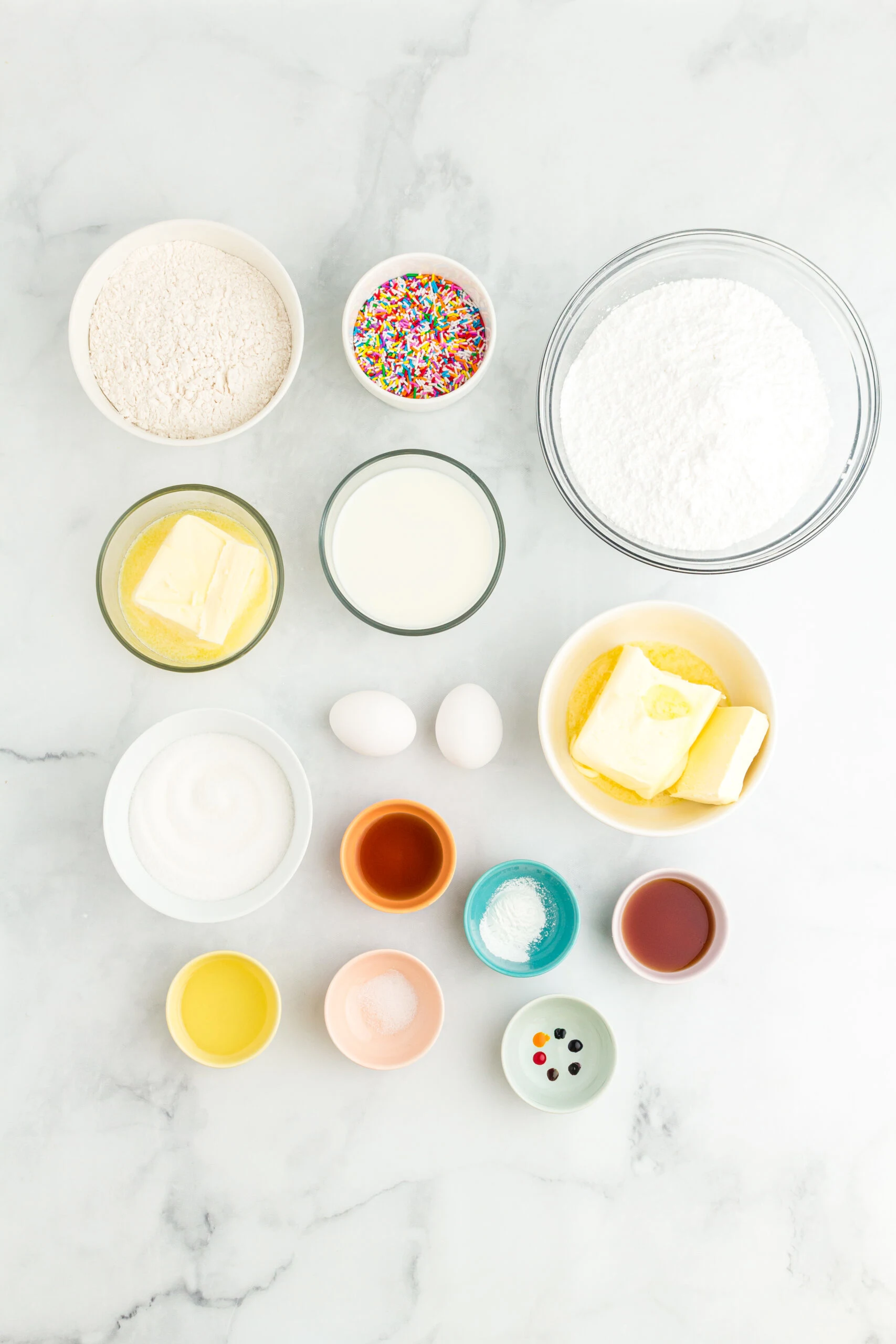 overhead photo of the ingredients needed to make a funfetti rainbow cake