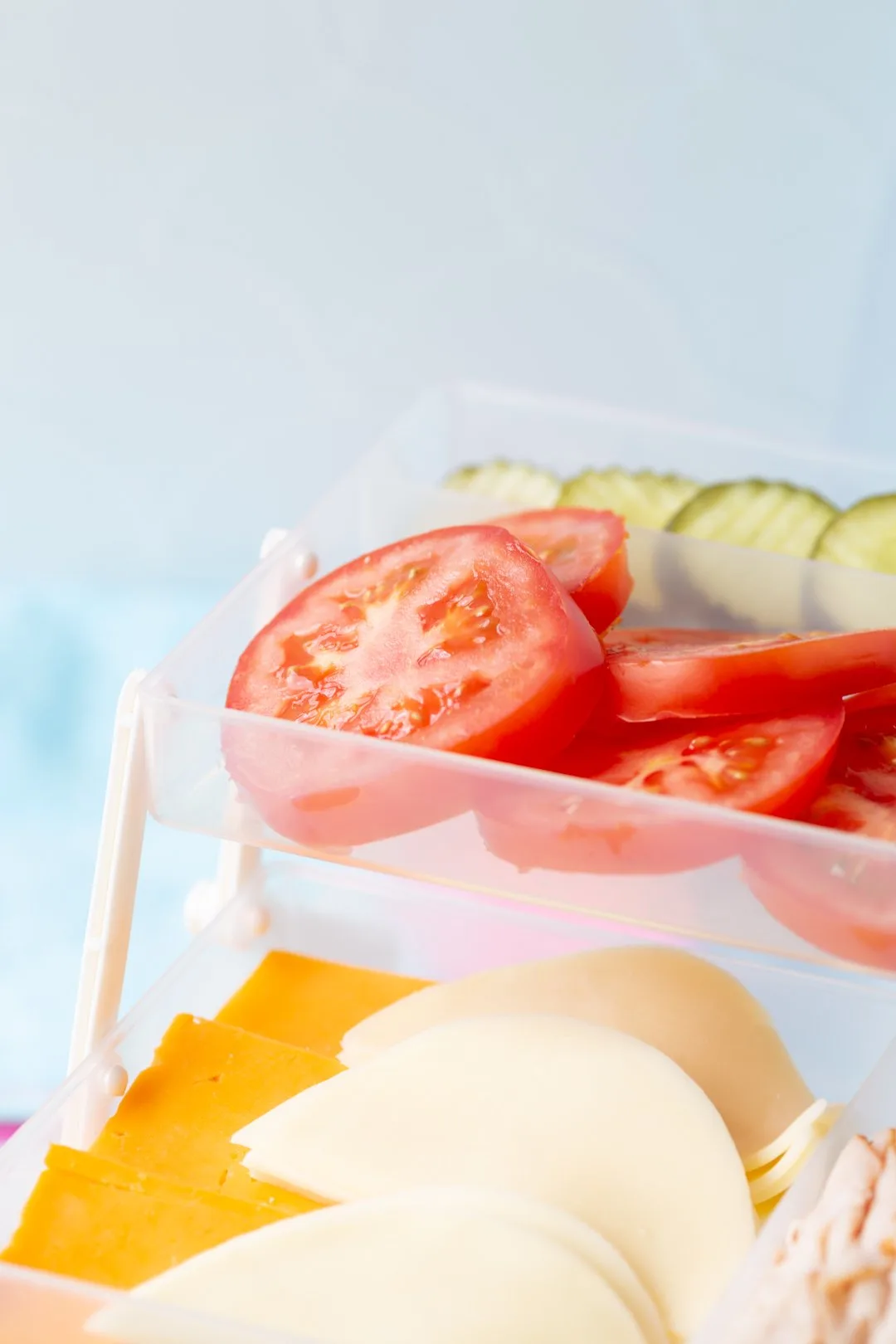 slices of tomatoes layered into a sandwich tackle box