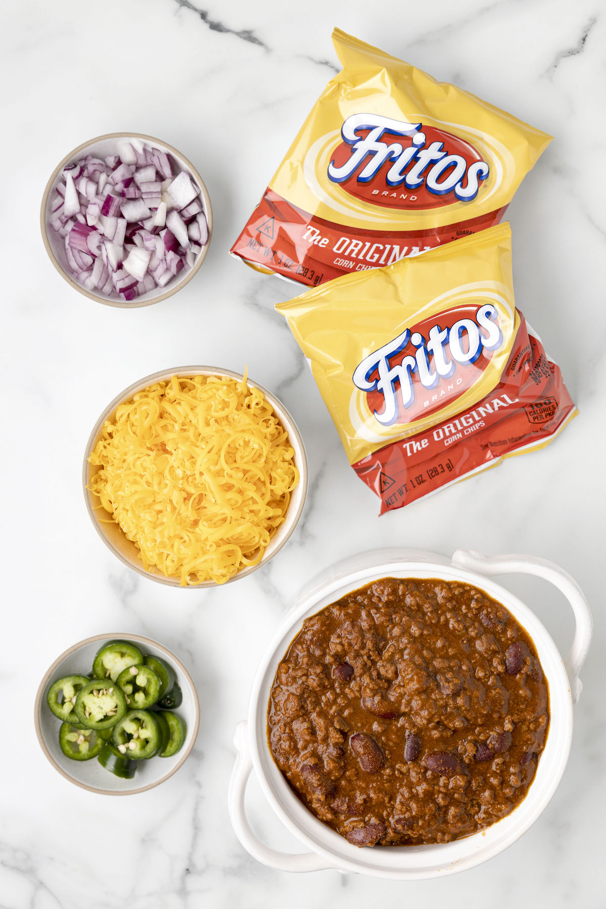 overhead view of ingredients needed to make walking frito pie