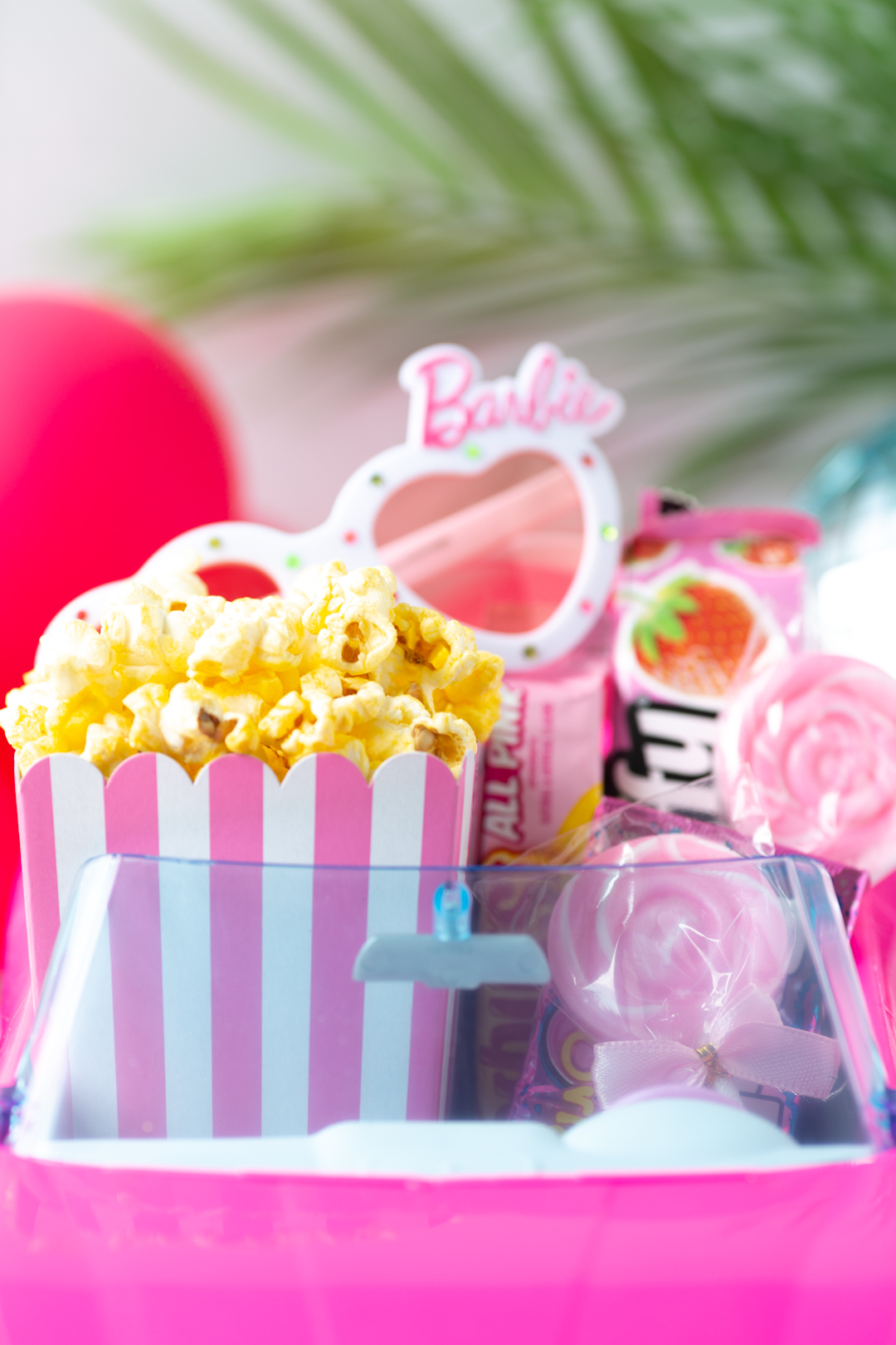 up close view of pink barbie themed movie snacks