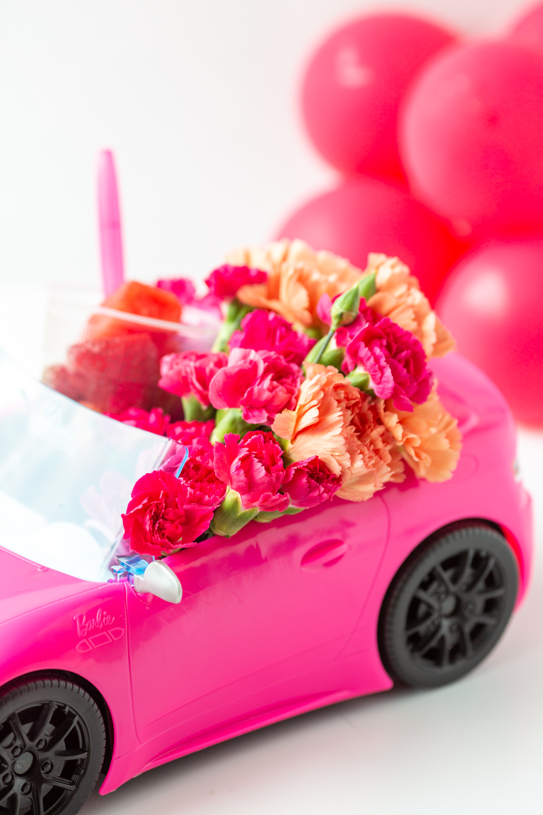 flower filled barbie car to use as a centerpiece