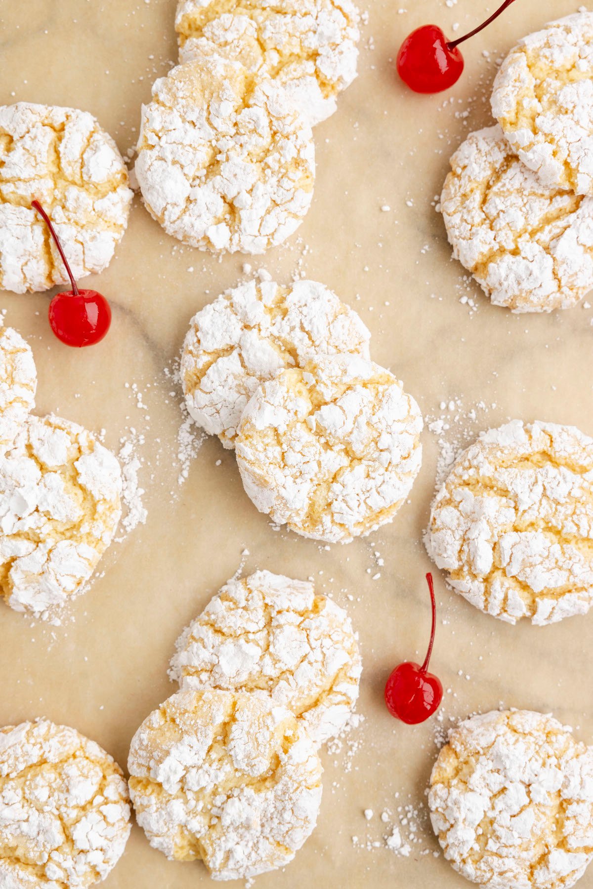 overhead view of pineapple crinkle cookies on parchment paper