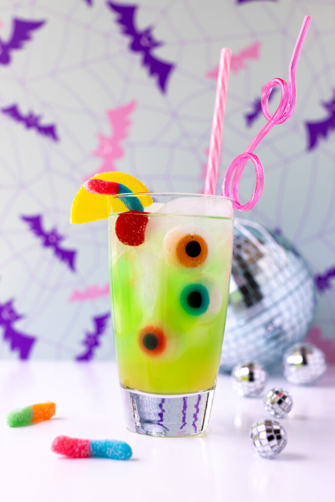 green ghoul juice for halloween parties or celebrating monster high: the movie watch parties with gummy eyeballs and sour worms.