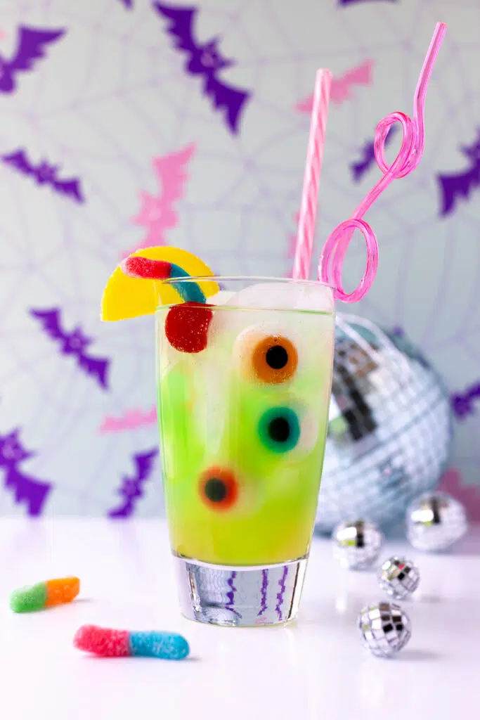 green ghoul juice for halloween parties or celebrating monster high: the movie watch parties with gummy eyeballs and sour worms.