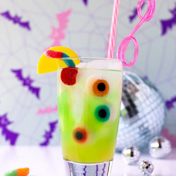 green ghoul juice for halloween parties or celebrating monster high: the movie watch parties with gummy eyeballs and sour worms.