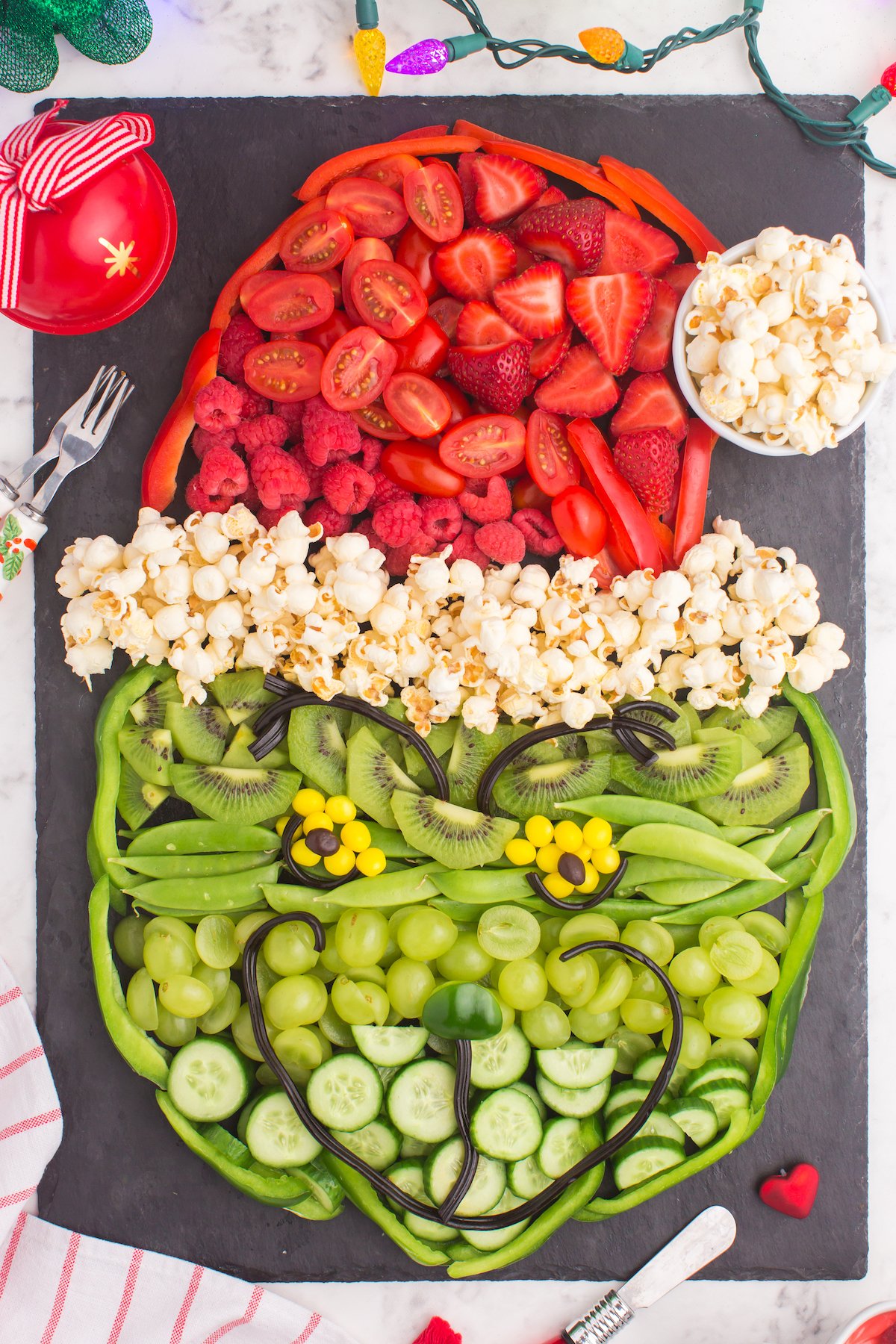 grinch made with fruit and vegetables, as a grinch fruit tray